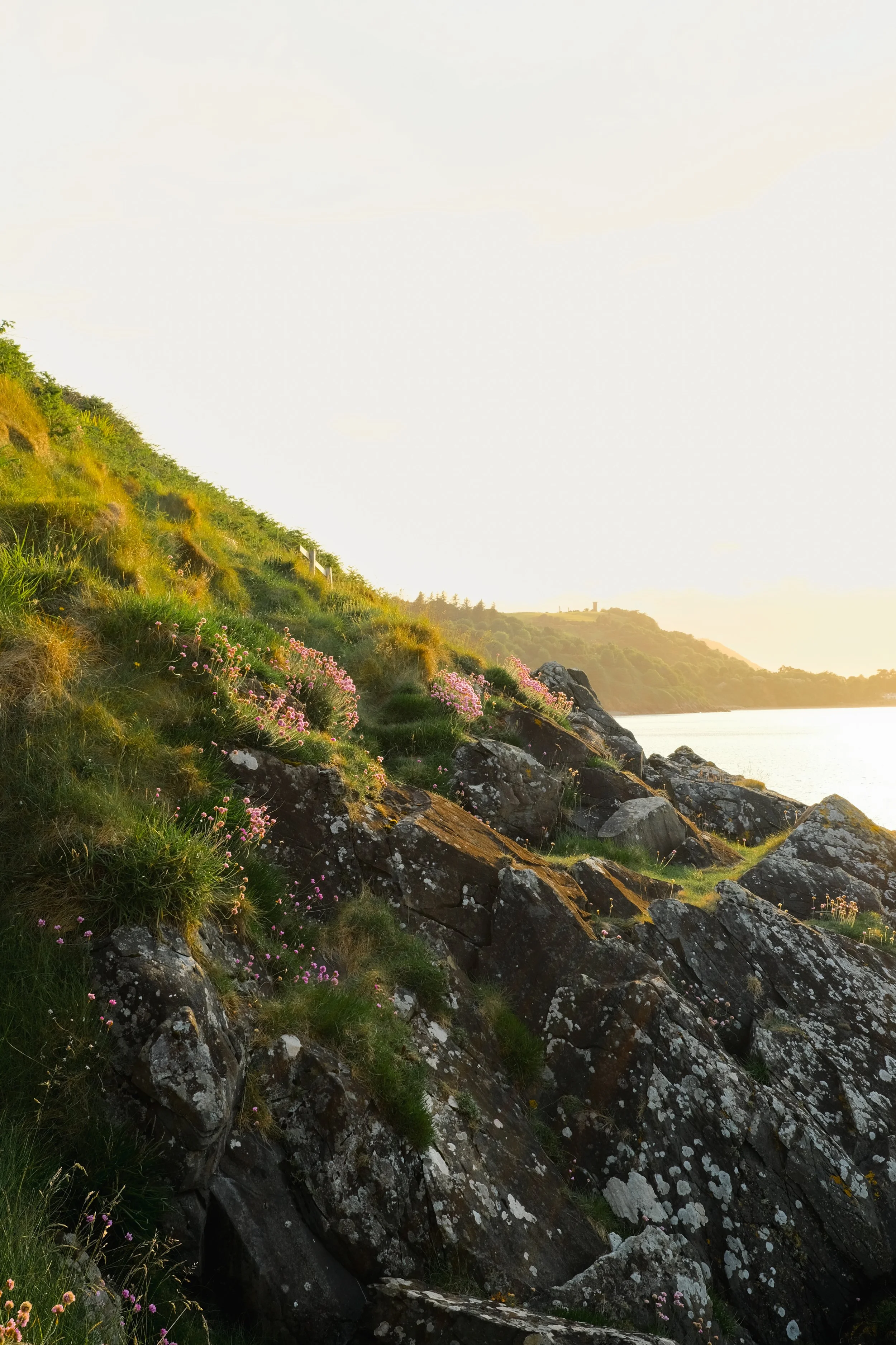 Orange sunset shining on the rocks on the East Coast of the Isle of Man