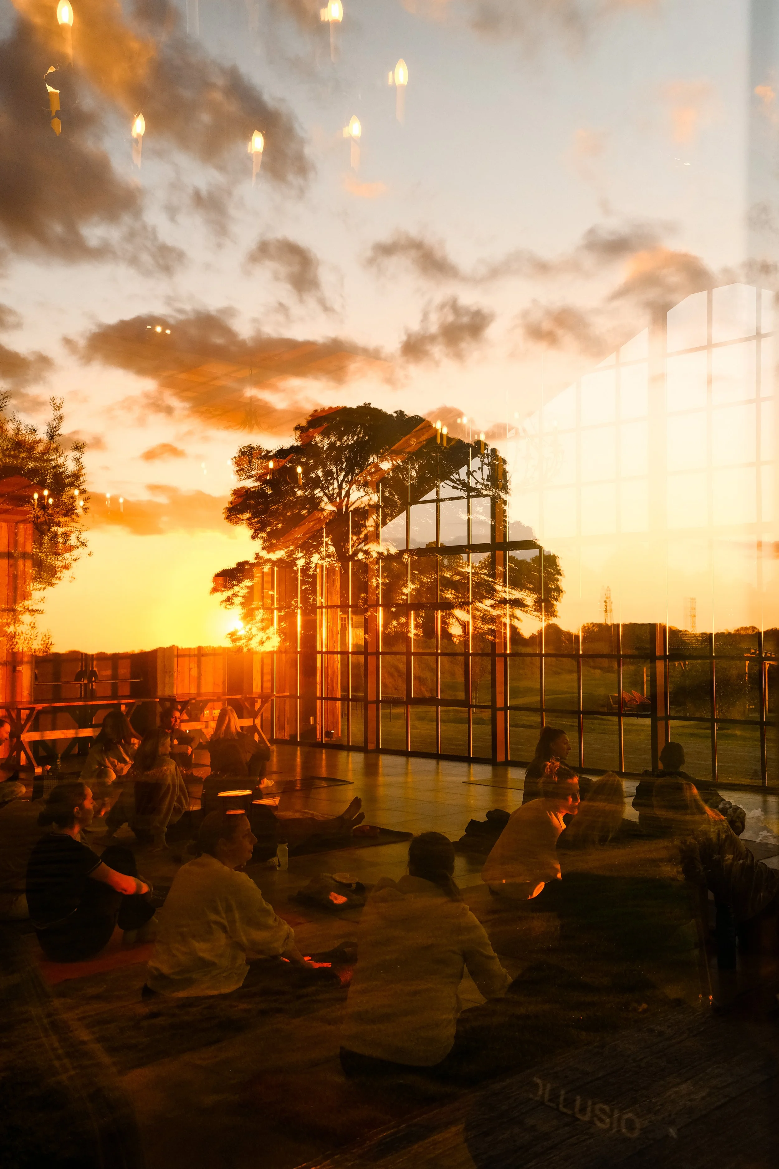 A pilates class and orange sunset reflections