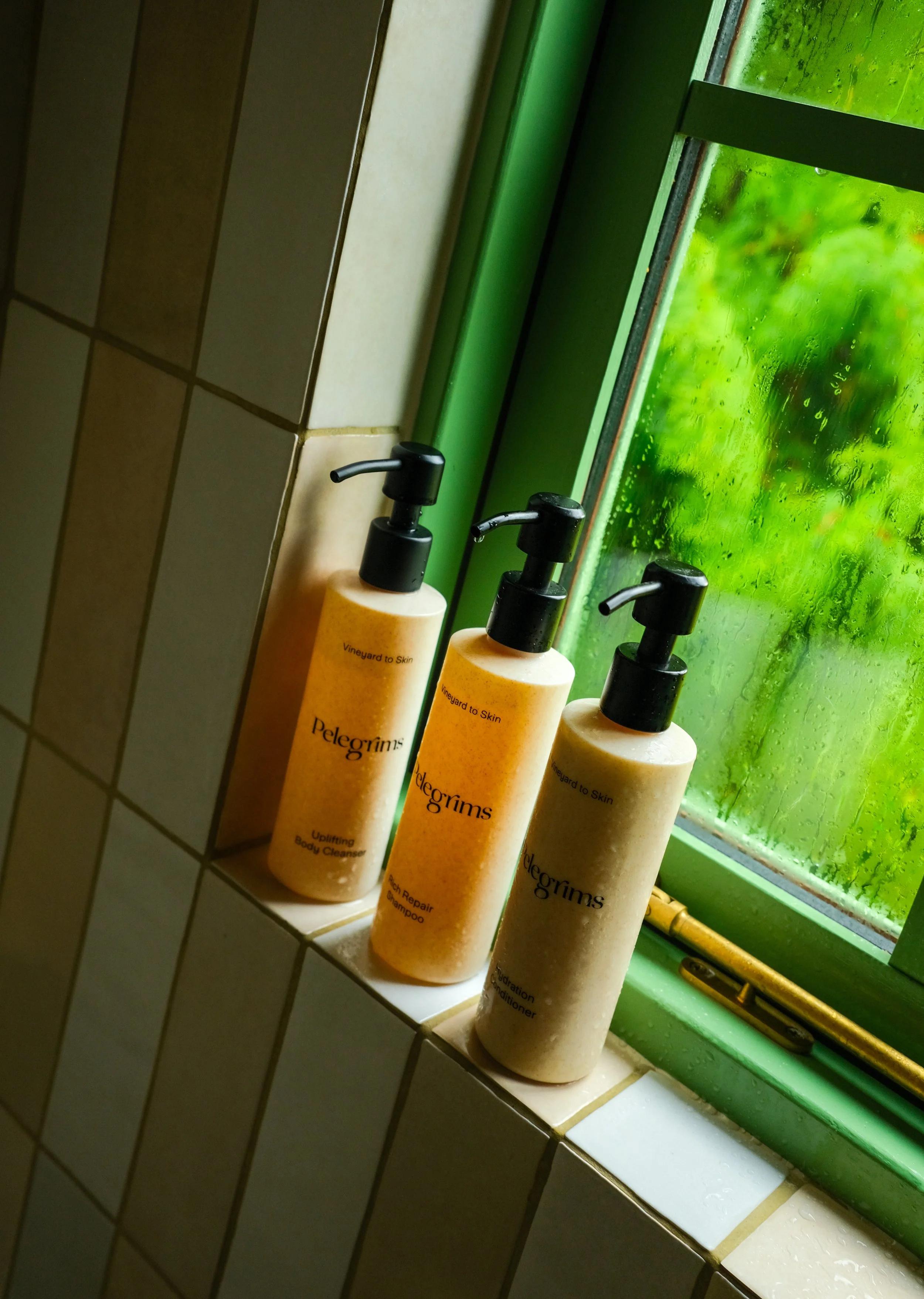 Pelegrims natural body wash, shampoo and conditioner in a shepherds hut bathroom shower