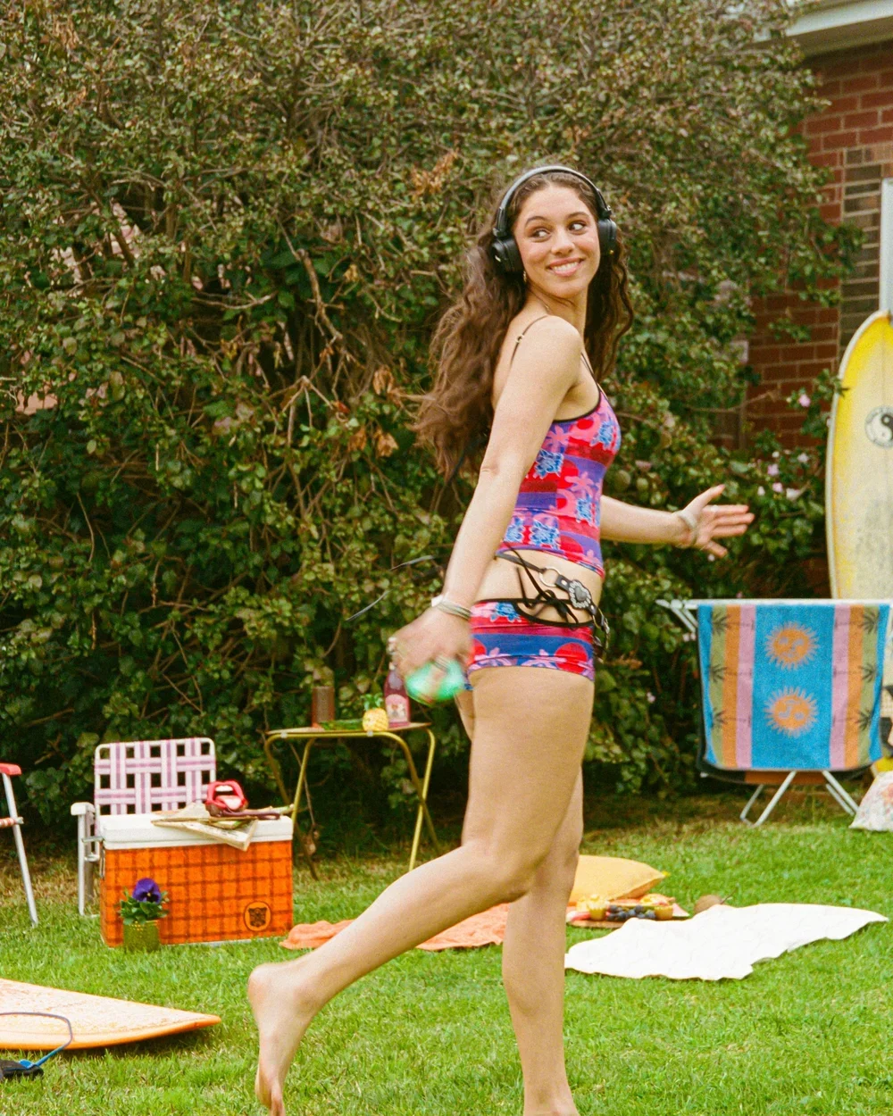 Girl running while wearing Love Stoner Lulu Shorties in Disco Croc print