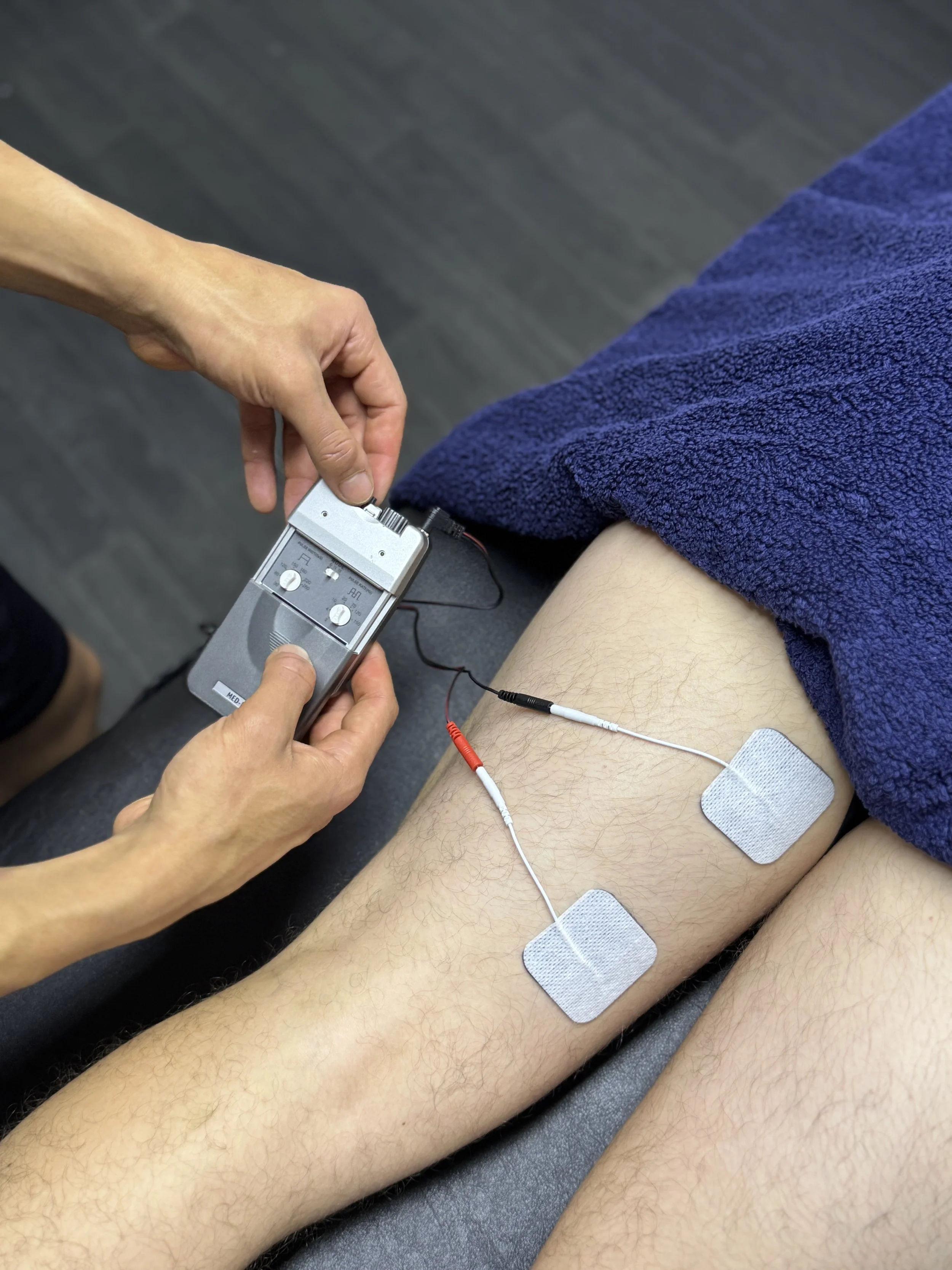 TENS being applied to hamstrings for pain relief