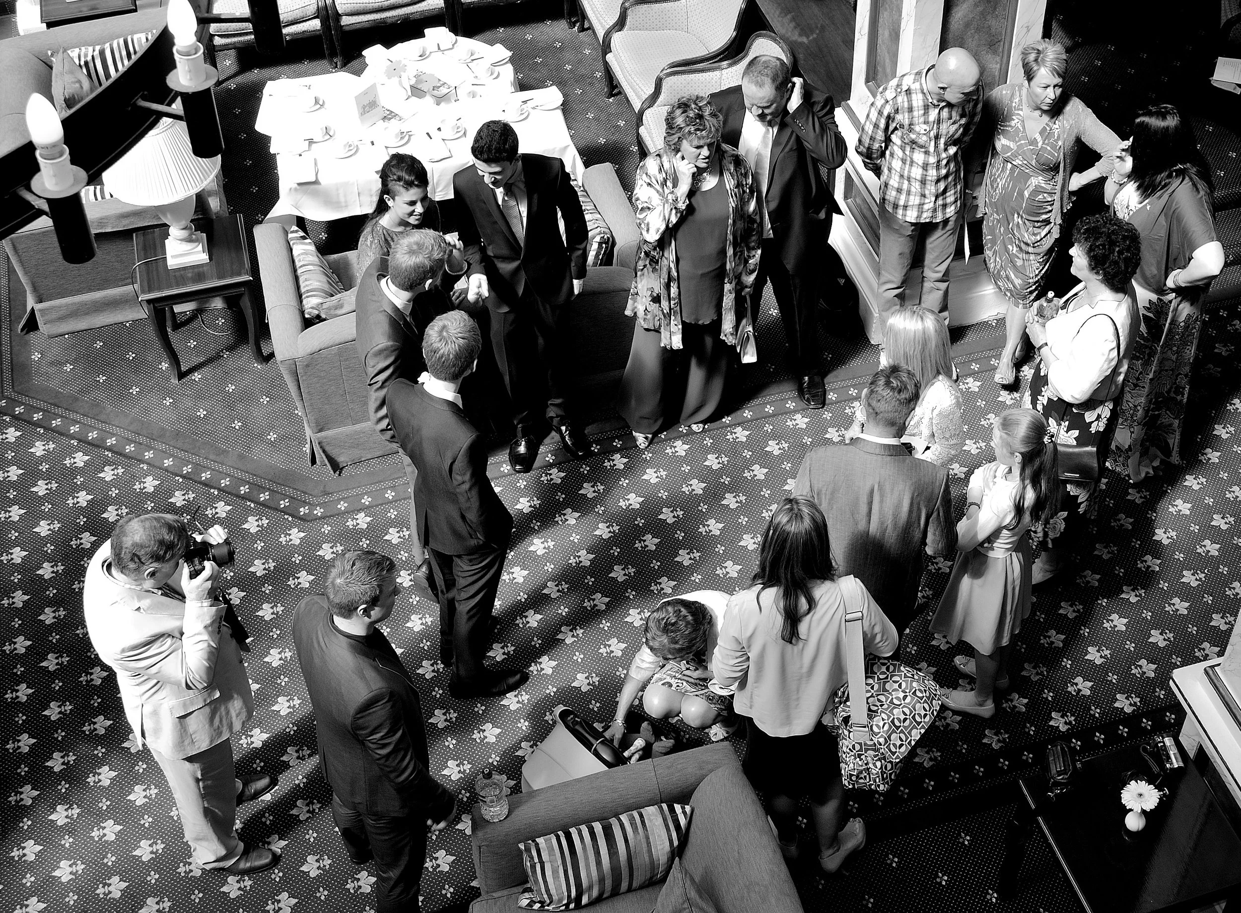 Black and white overhead view of guests at an event