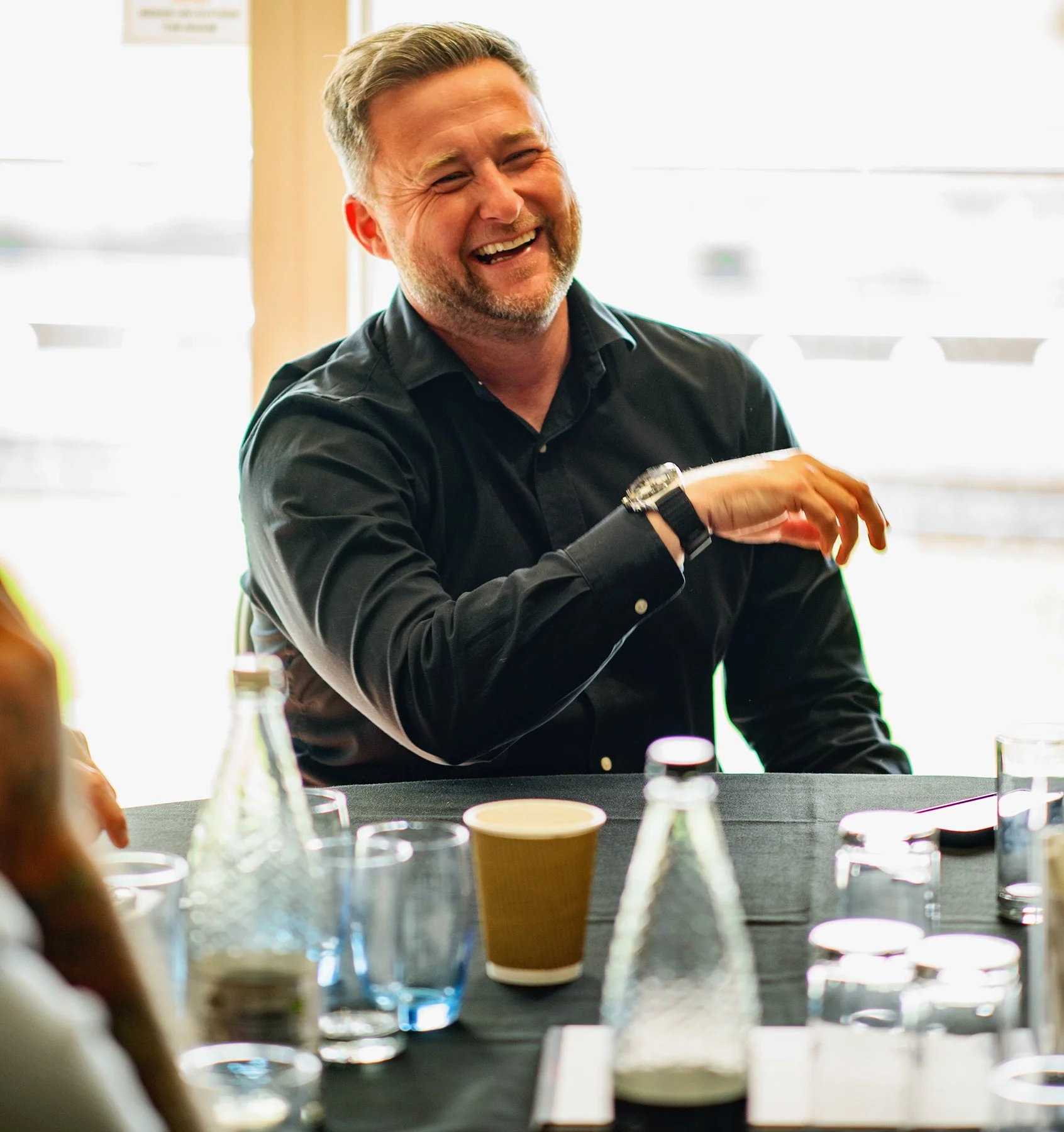 Candid laughter image at corporate event South East
