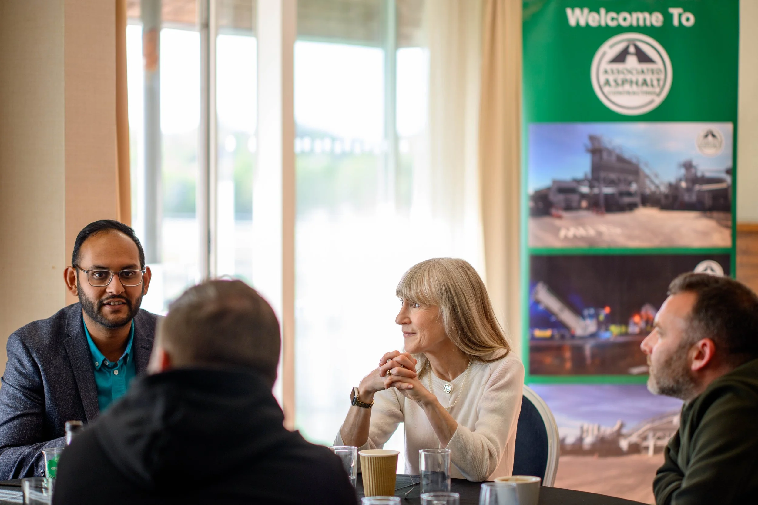 Delegates in discussion at a corporate conference