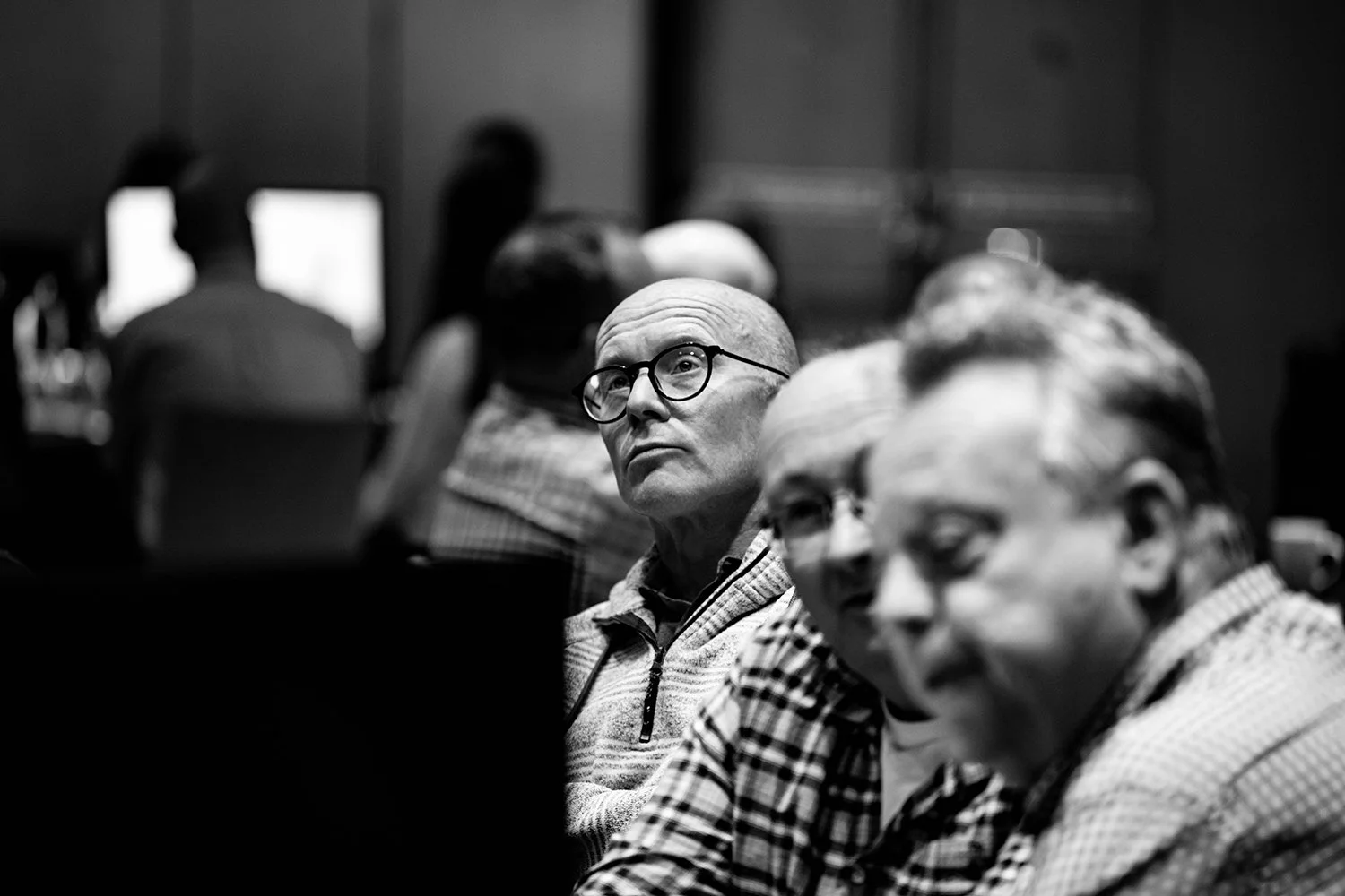 Black and white candid of a conference audience