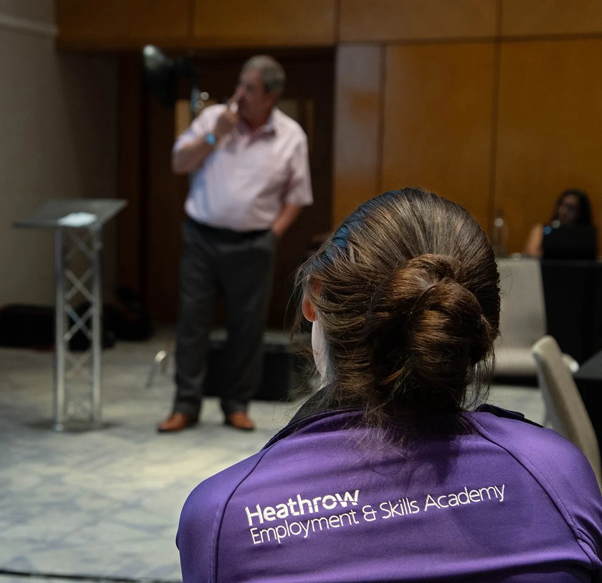 Speaker presenting at a corporate conference