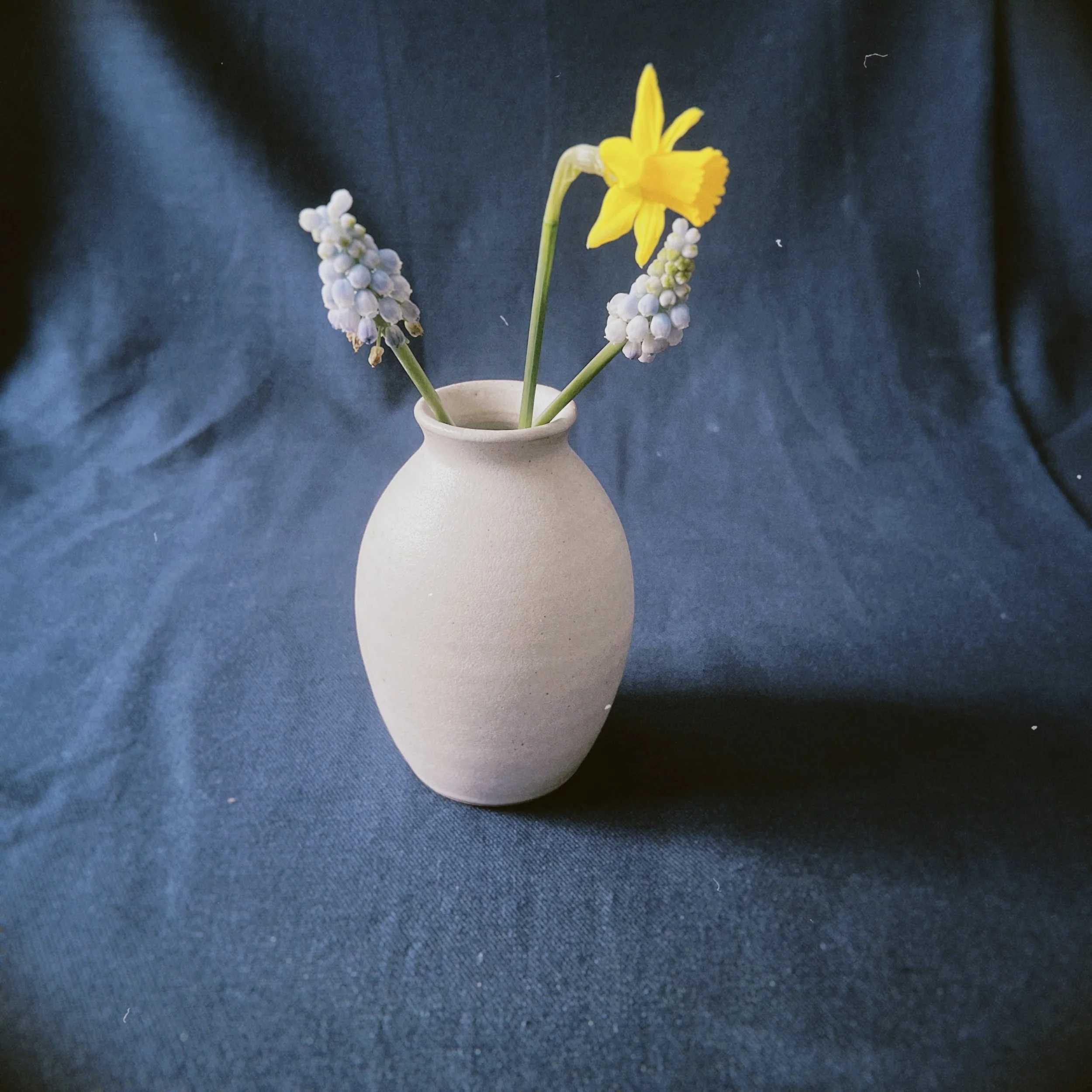 a small vase with flowers