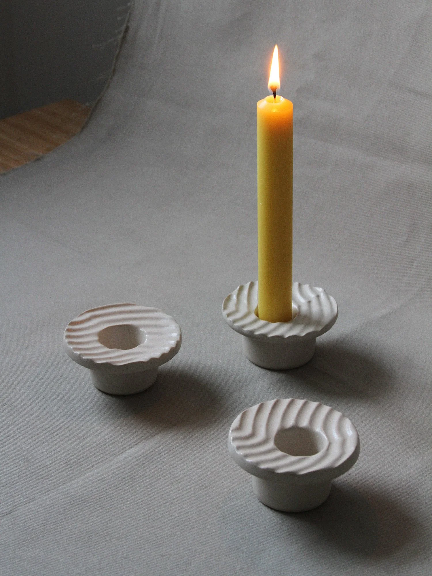three textured candlesticks