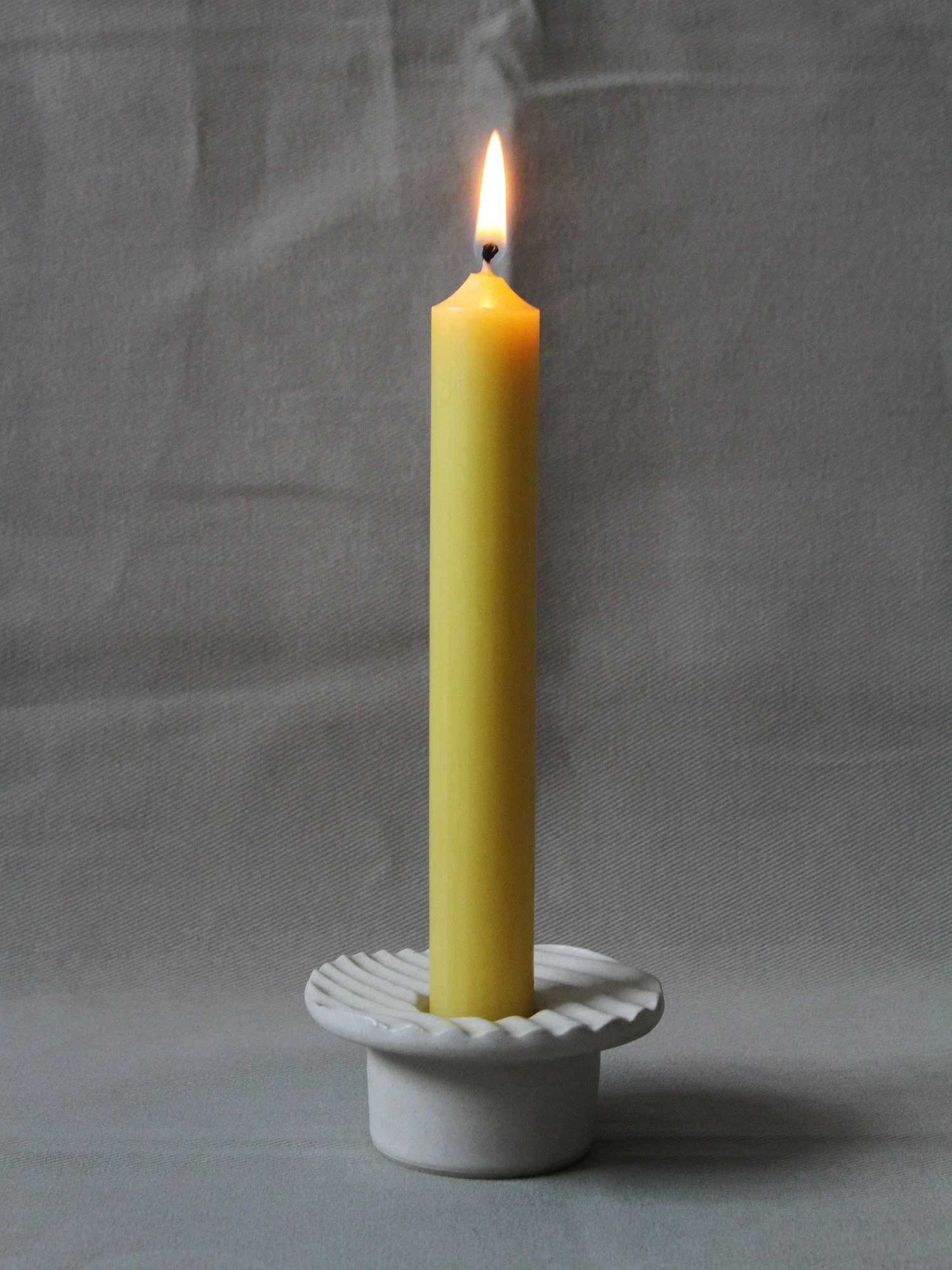 candle in textured candlestick