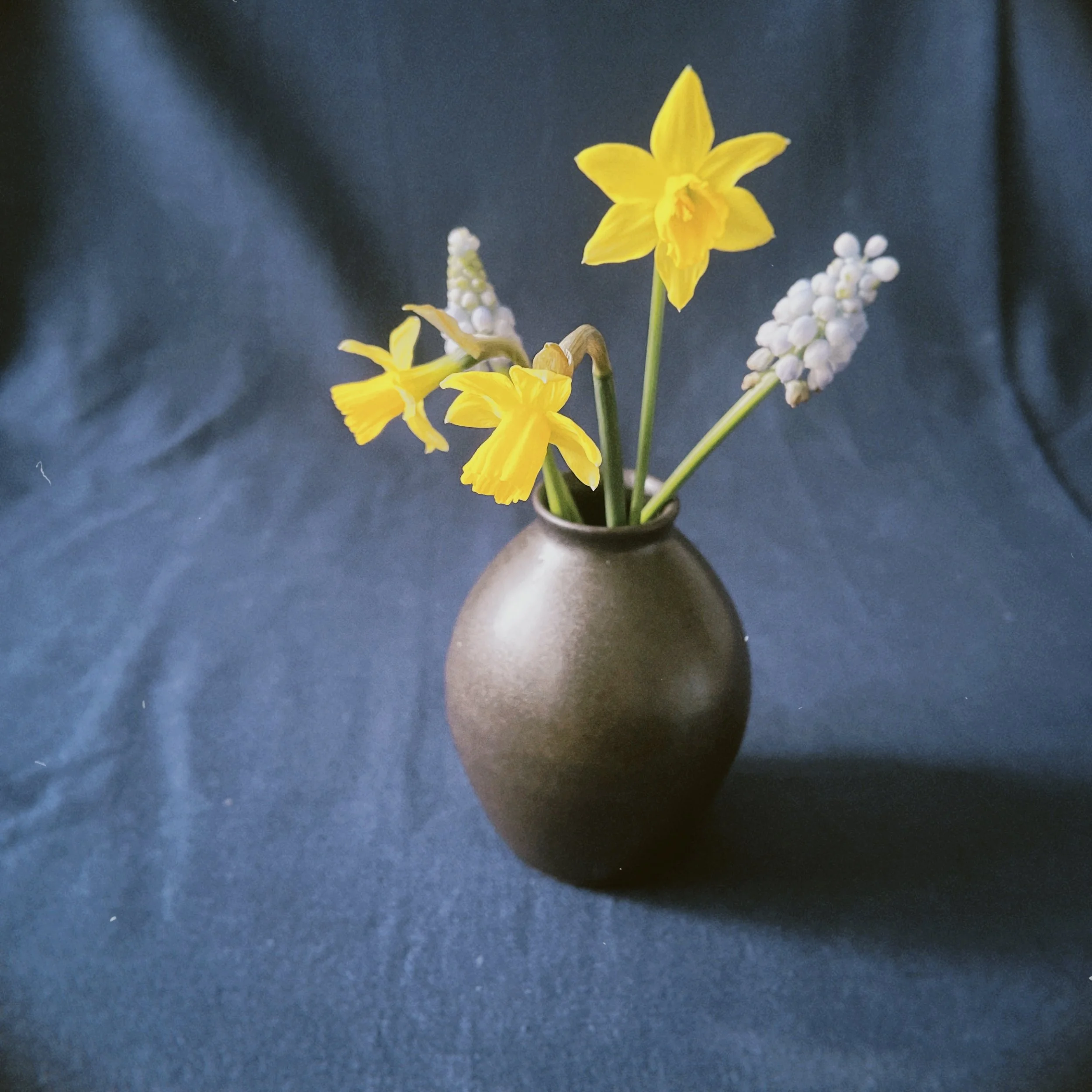 a small vase with flowers