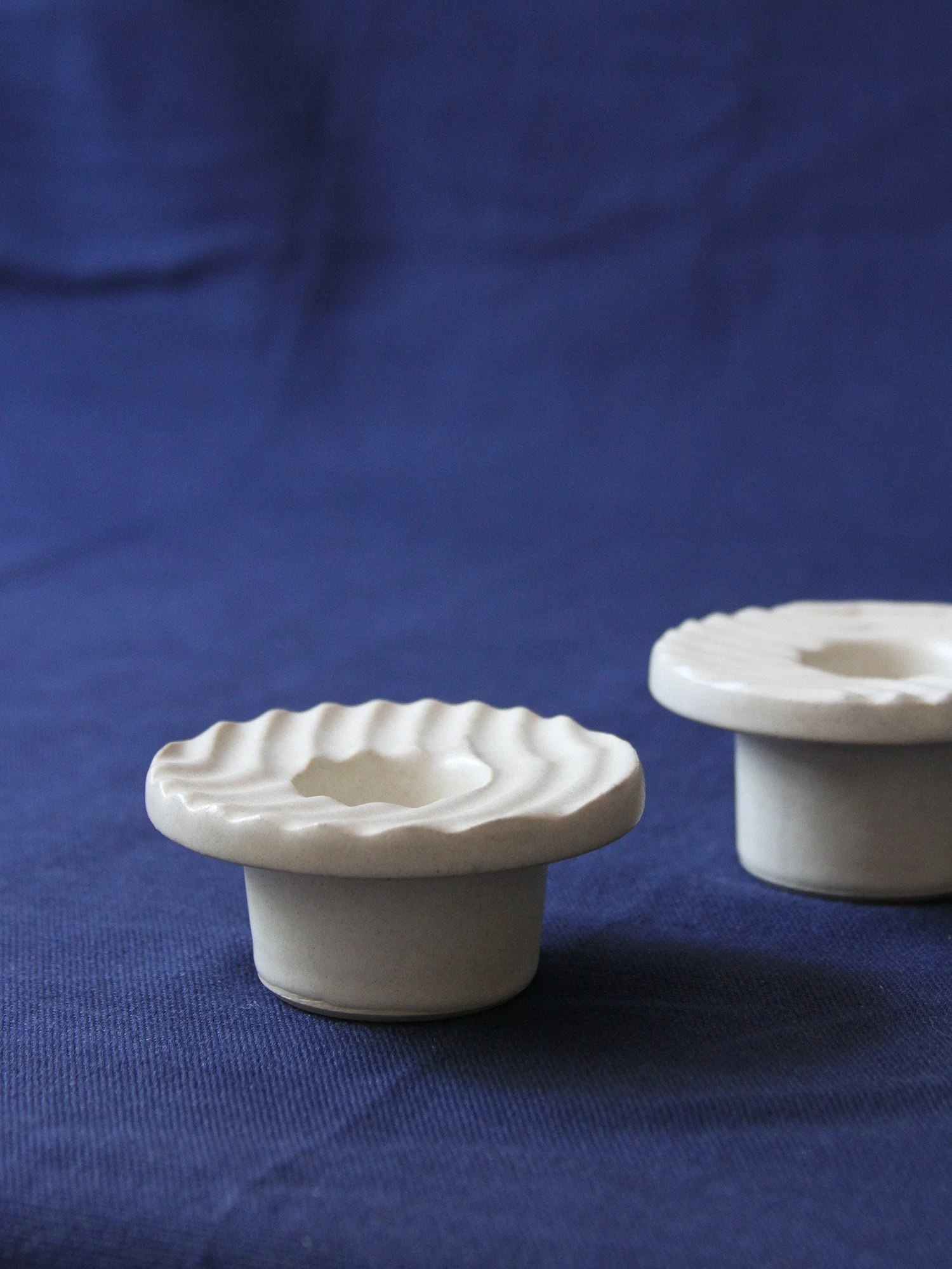 two textured candlesticks