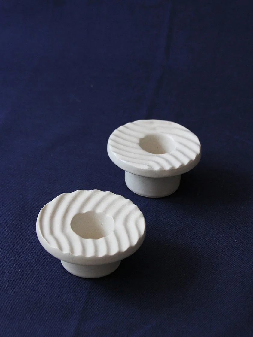 two textured candlesticks