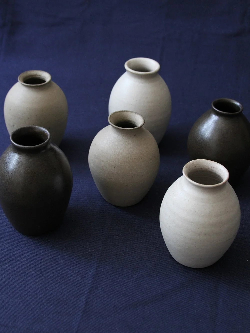 a collection of small vases
