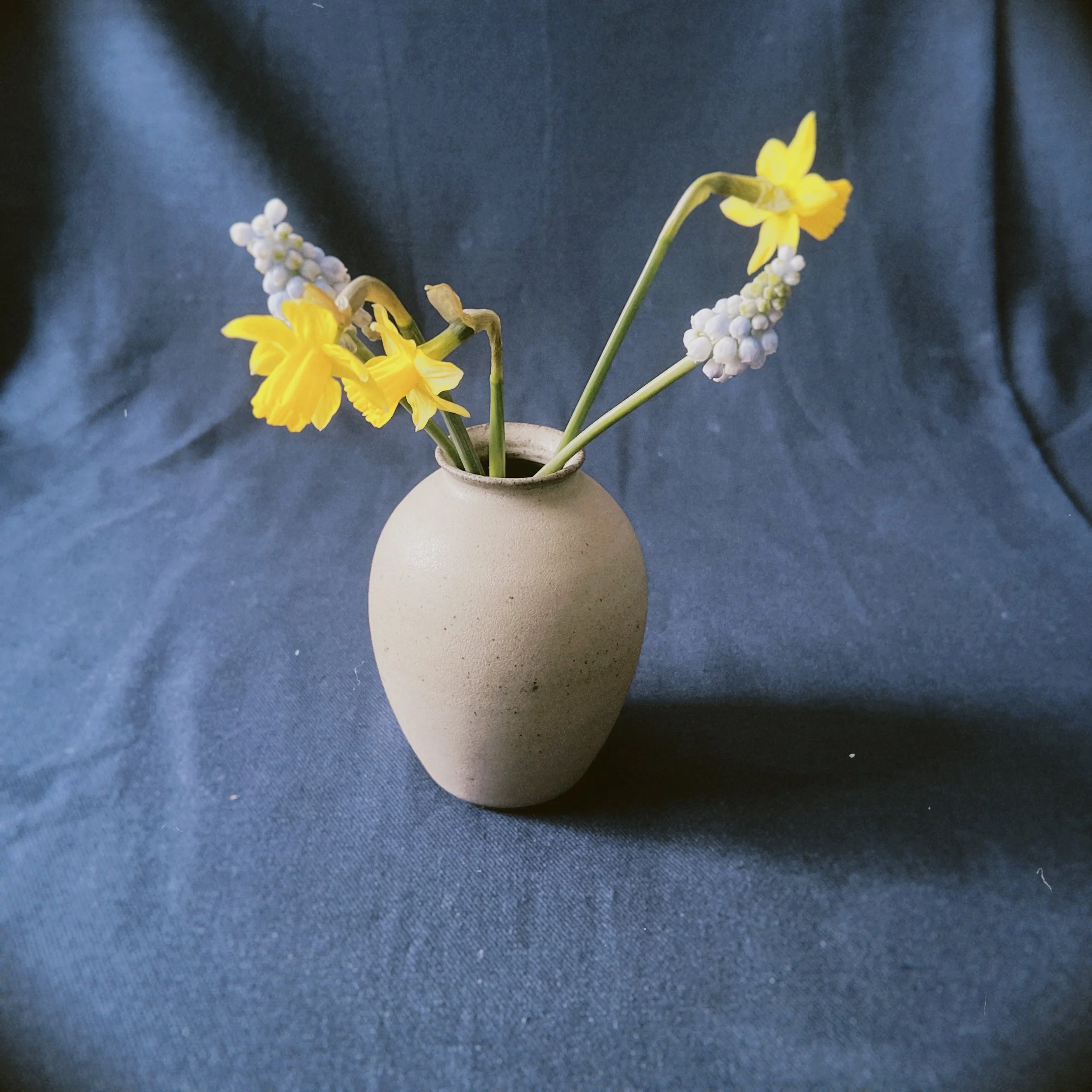 a small vase with flowers