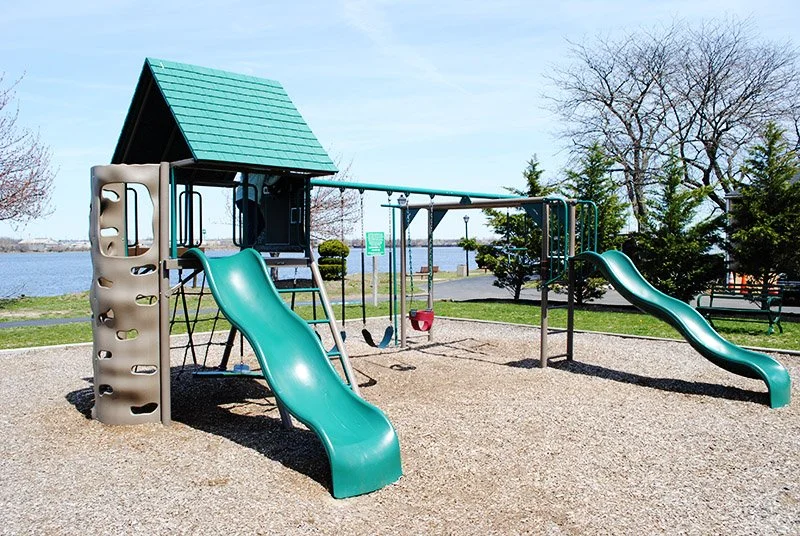 Our children's playground has a beautiful view of the river.