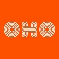 Design of three abstract shapes with concentric circles and a grid-like pattern on an orange background.