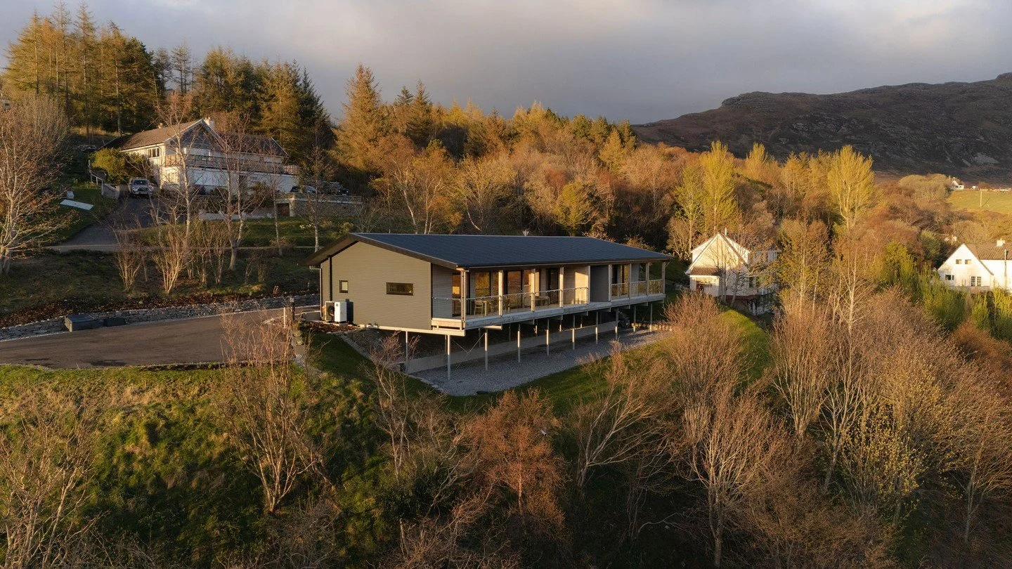 The building sits above the loch, set into the slope with a clear view west.⁠
⁠
Two self-contained apartments run the full length, each with a covered deck and uninterrupted outlook. The structure is simple and elevated, allowing the landscape to rem