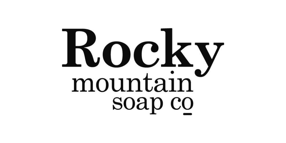 Logo for Rocky Mountain Soap Co. in black and white, featuring stylized mountain peaks above the text.