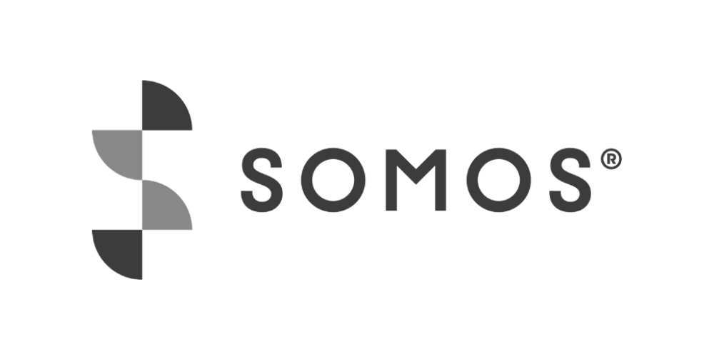 The logo of the global organization Somos with the text 'SOMOS' next to a geometric symbol composed of black and gray shapes.