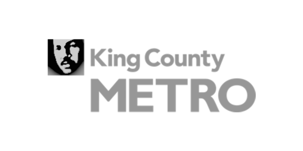 Black and white logo for King County Metro with a stylized face of a man and text reading "King County Metro".
