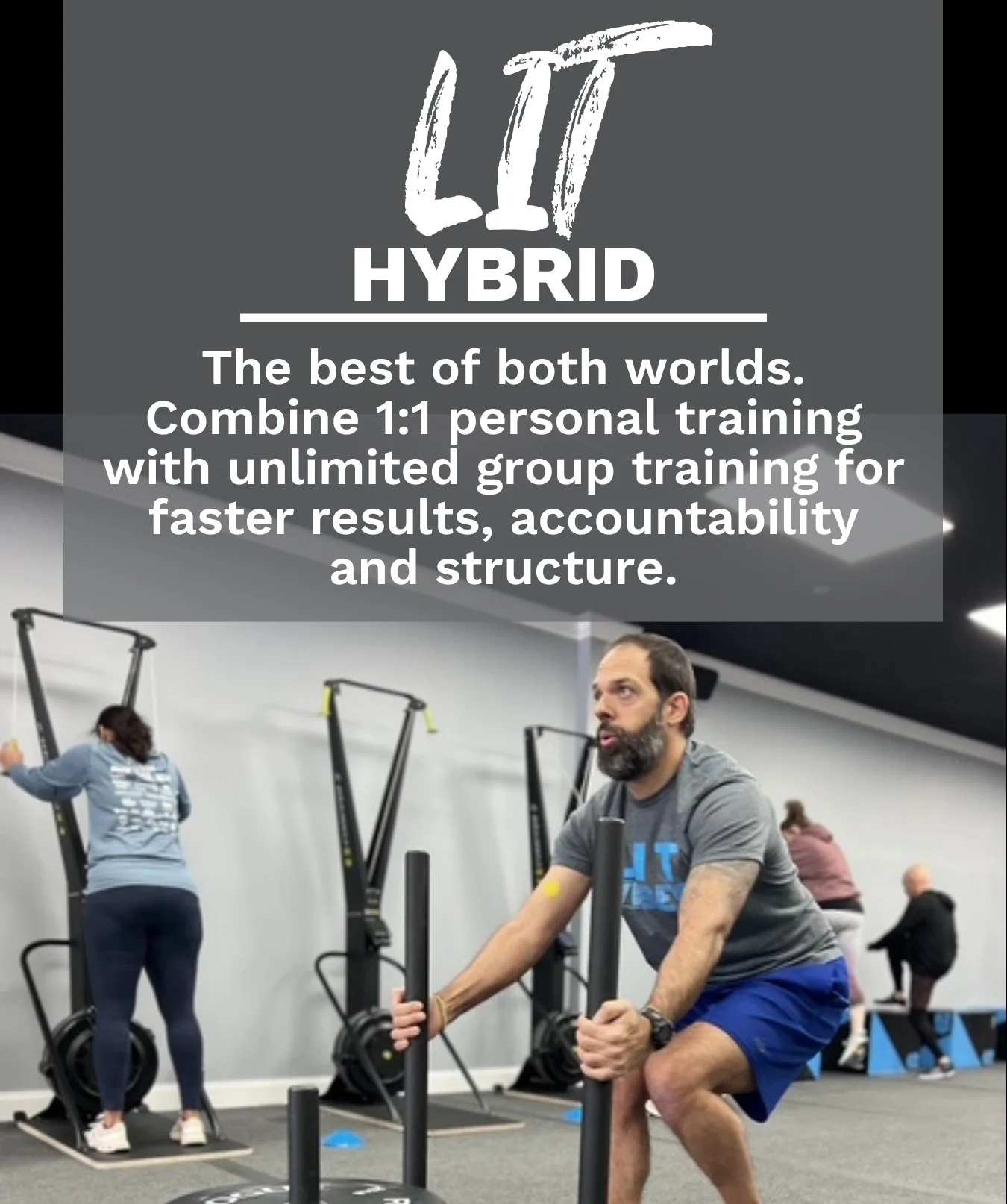 A man exercising on sled pushes in a gym, with other people working out in the background.