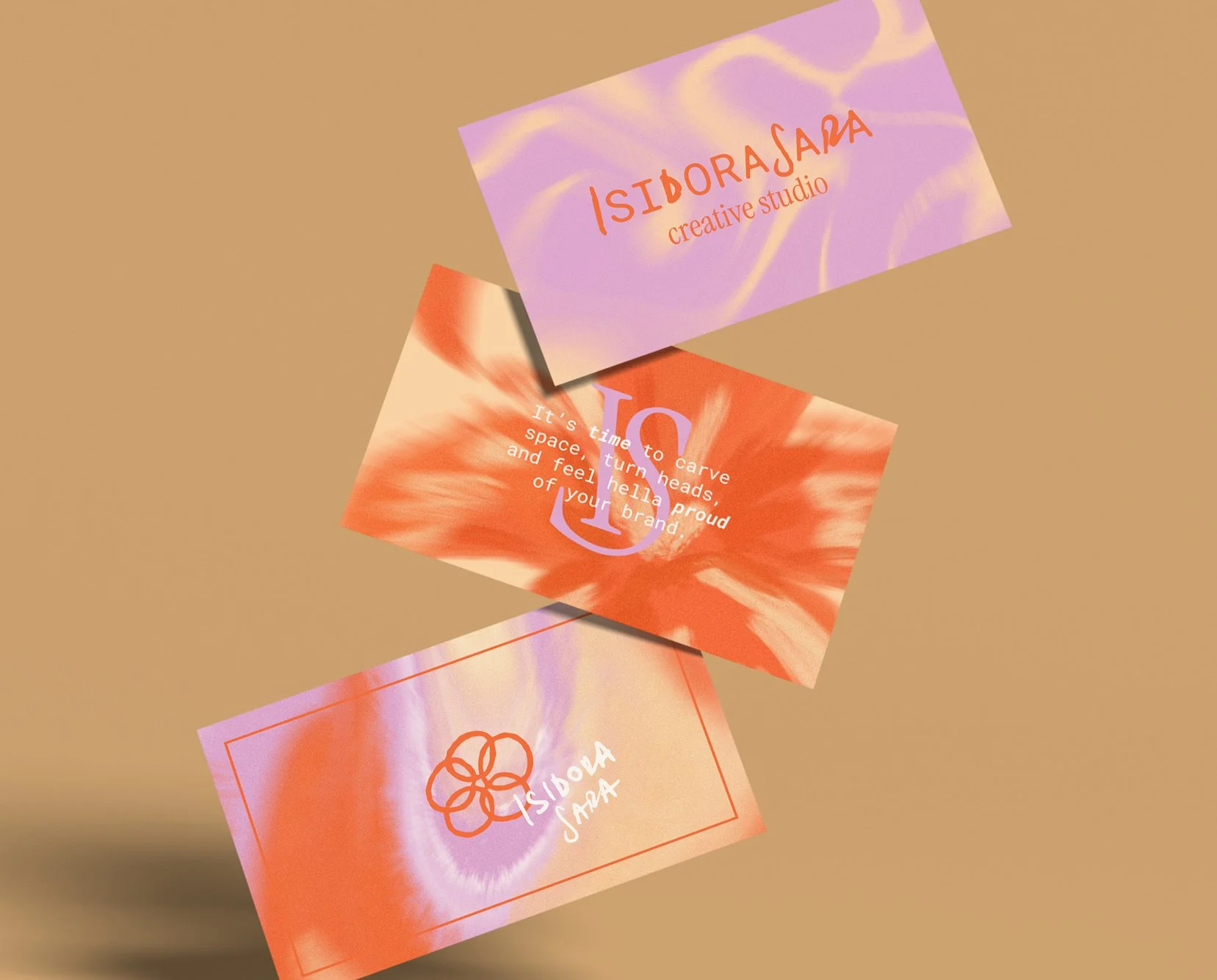 Three colorful business cards with abstract designs and text, floating over a beige background.