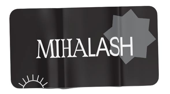Close-up of a black surface with the word 'MIHALASH' in white letters and a gray geometric star shape.