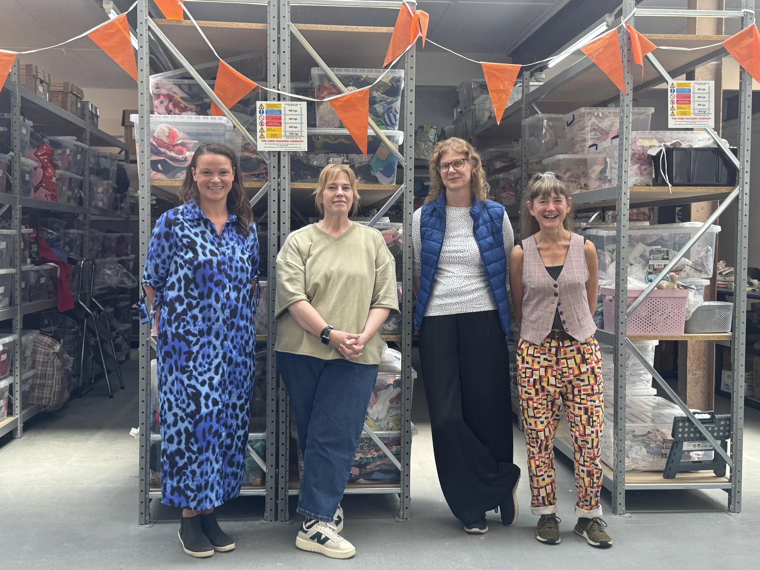 Council Leader Bella Sankey, Elaine Bailey and Shelley Bennett of Pelican Parcels, and Councillor Mitchie Alexander at the charity's warehouse in Hove