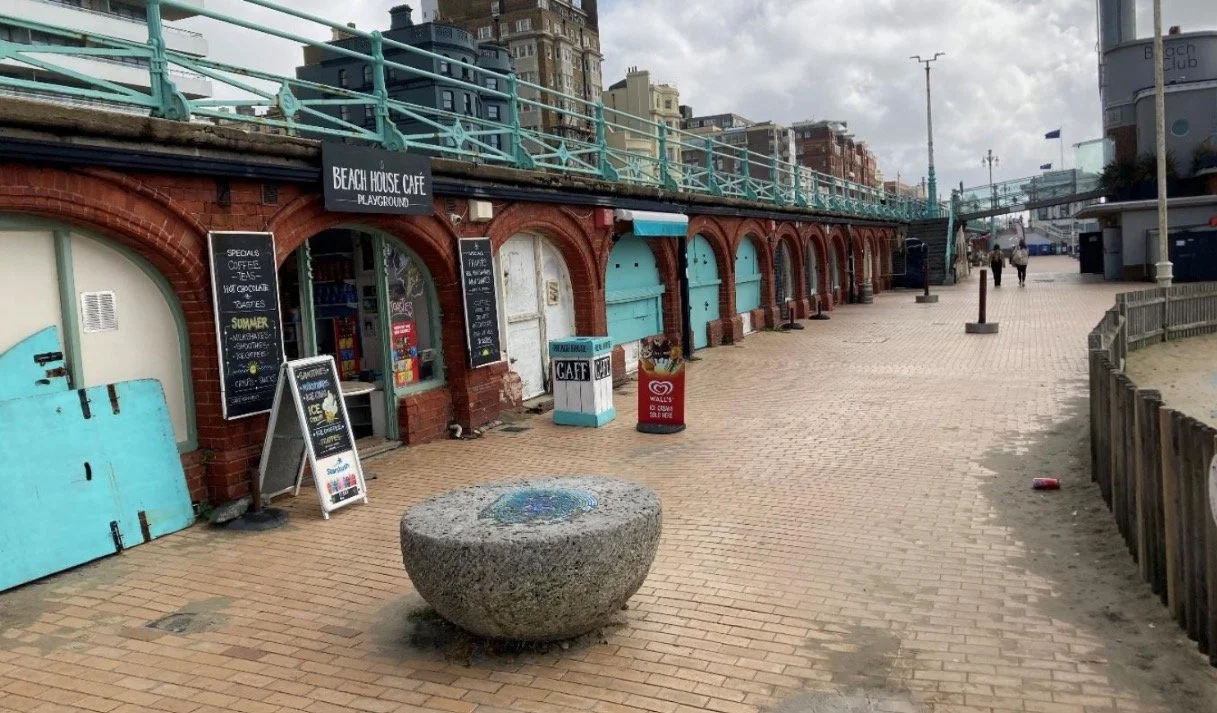 The rebuilt Victorian arches on King's Road seafront in Brighton with shops and cafes underneath