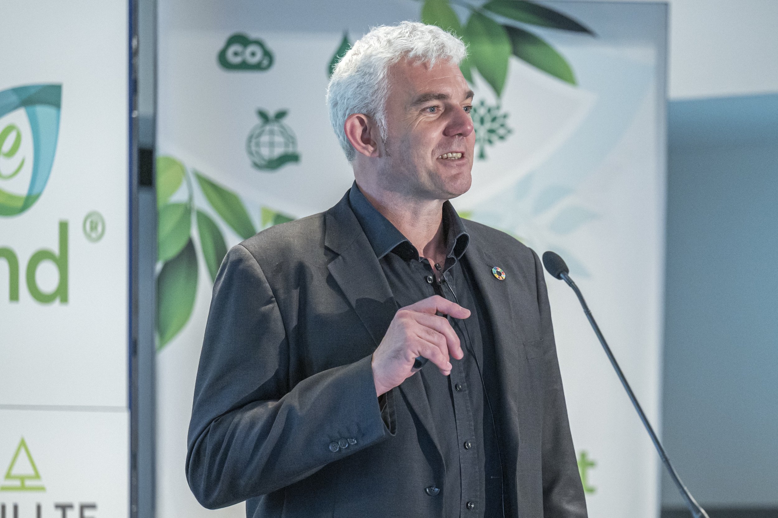 Professor David Greenfield speaking at a podium, new chair of the Brighton and Hove Business Growth Board