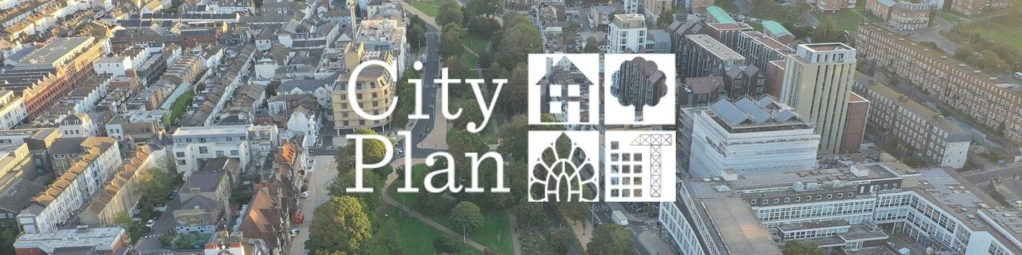 Aerial view of Valley Gardens in Brighton, showing the tree-lined green space running through the city towards the sea