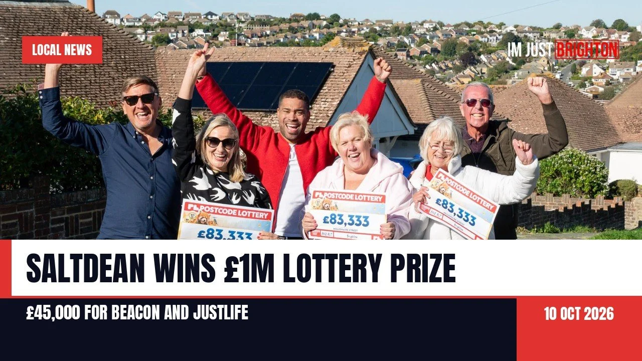 Five winners from a Saltdean street, smiling with their arms raised and holding Postcode Lottery cheques for 83,333 pounds, with rooftops and hills behind them