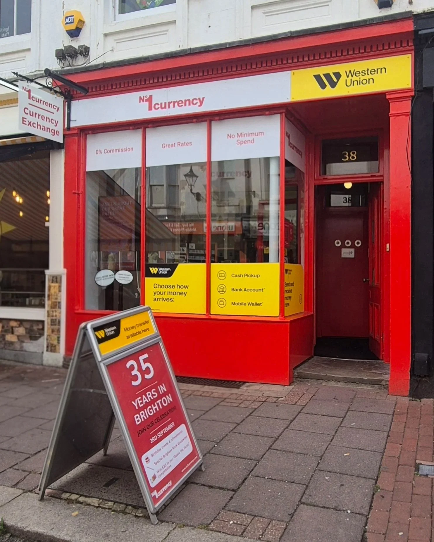 No1 Currency Brighton shop front at 38 Ship Street with the 35 Years in Brighton A-board outside