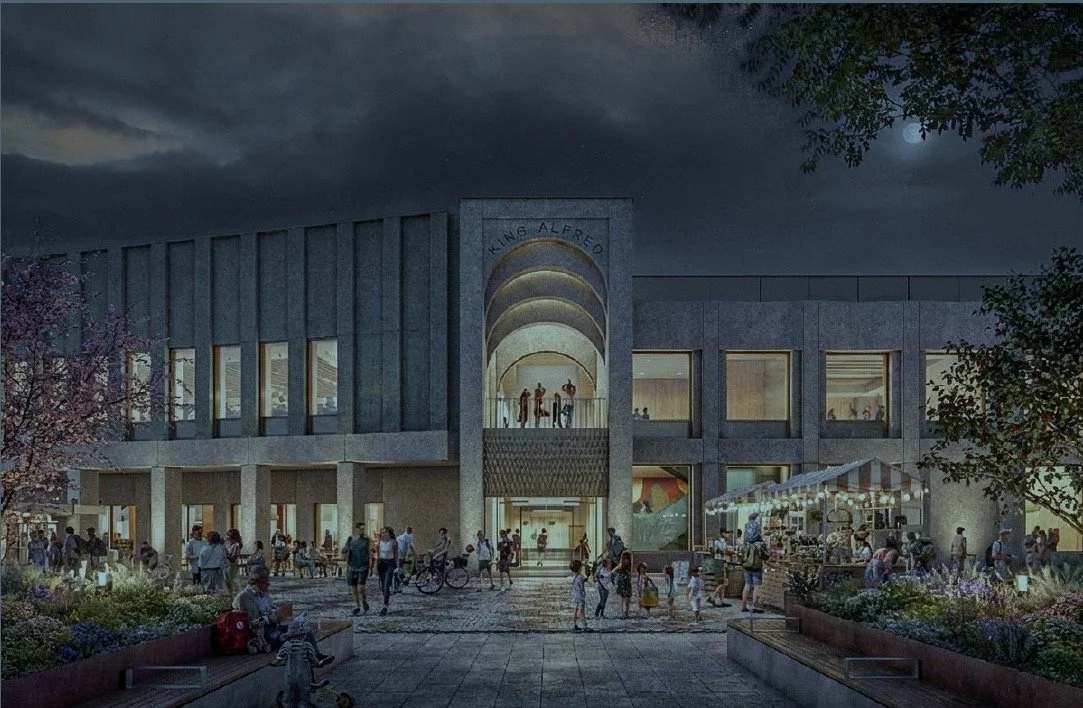 Night view of the proposed new King Alfred entrance with people gathered outside and a market stall