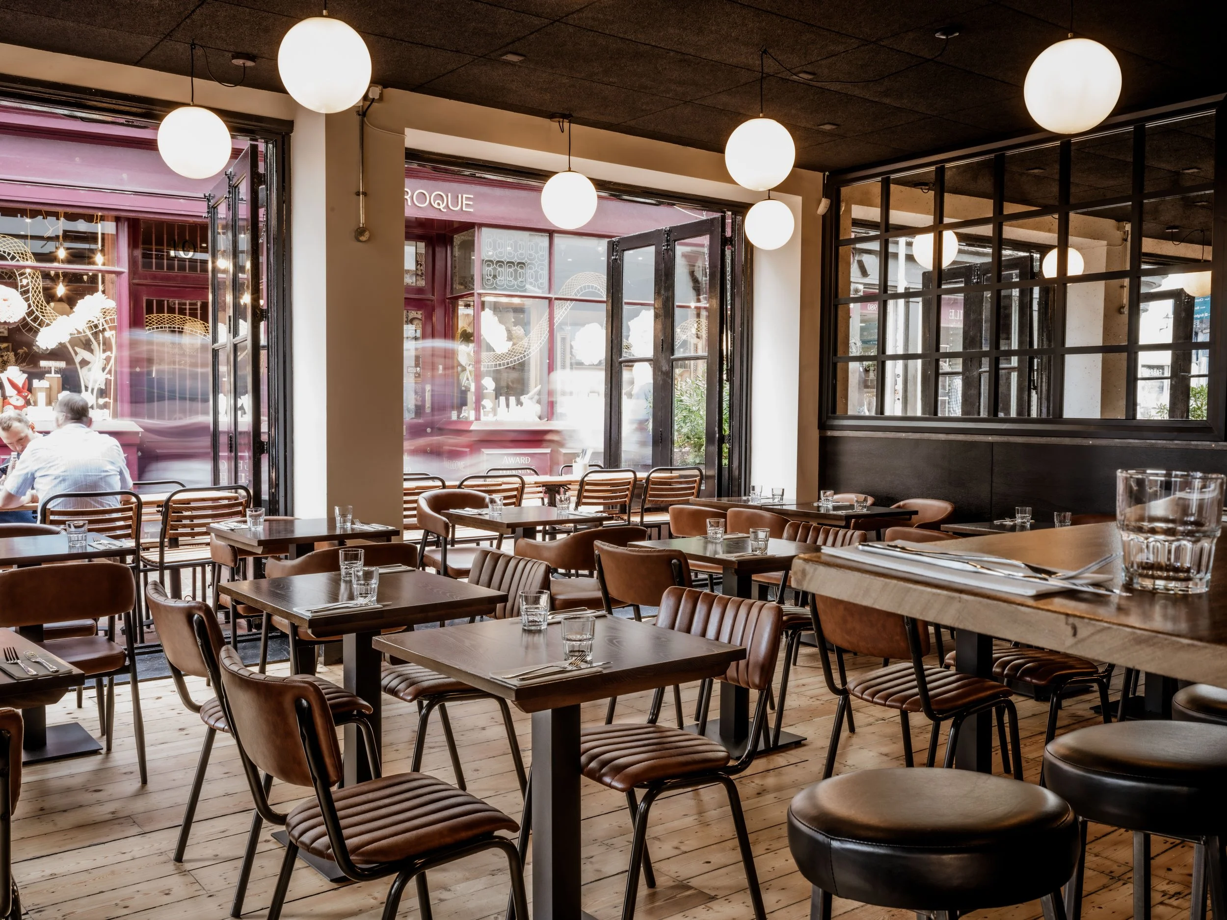 Interior of the Burger & Beyond restaurant on Ship Street in Brighton, showing the dining area and seating