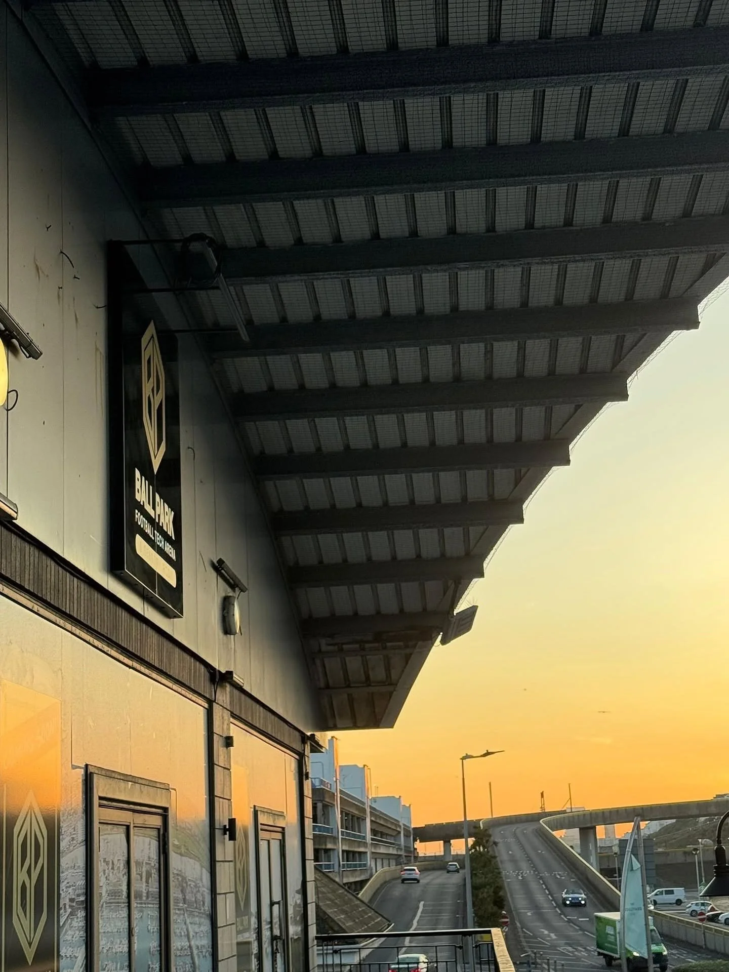 Ball Park football tech arena sign on the building at Brighton Marina at sunset