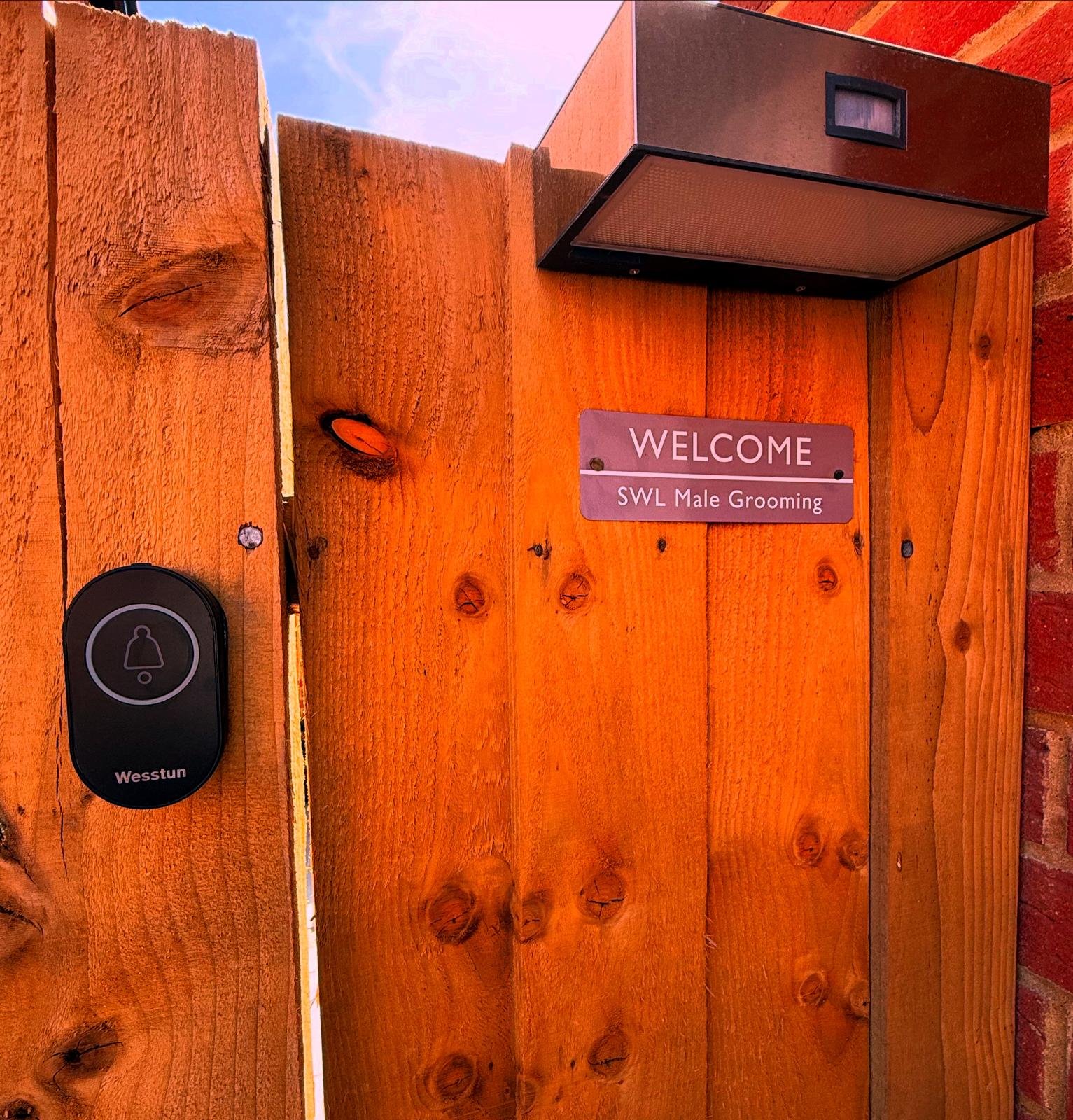 Welcome sign and entrance gate to SWL Male Grooming private studio in Goring-by-Sea Worthing West Sussex