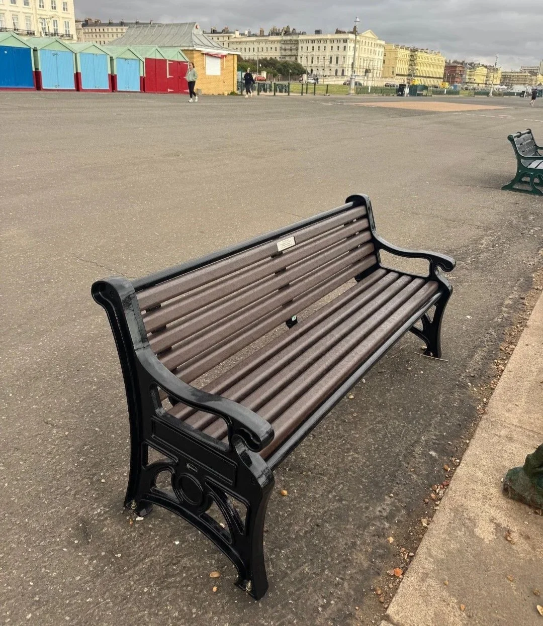 memorial bench with plaque on Brighton seafront promenade