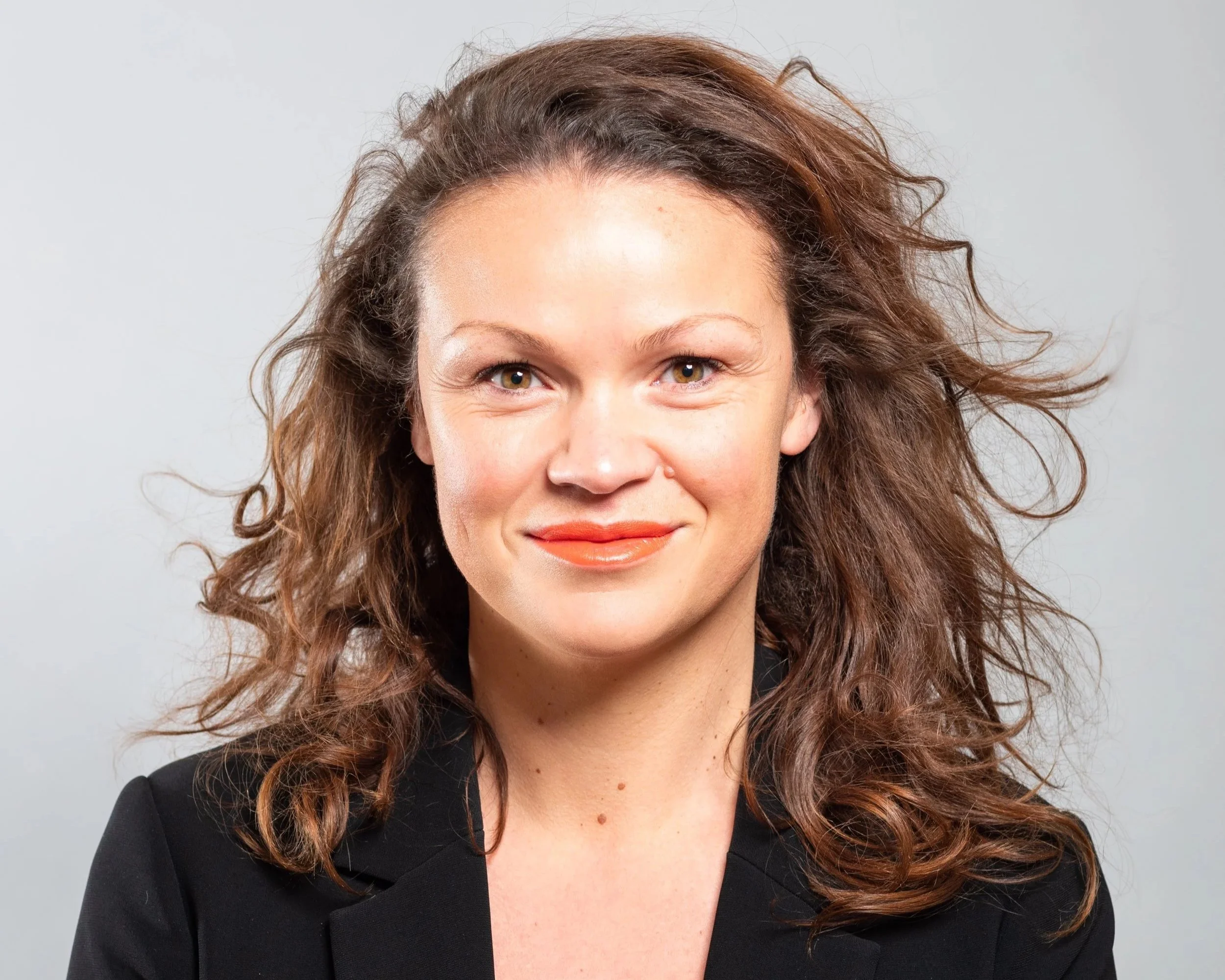 Councillor Bella Sankey, Leader of Brighton and Hove City Council, wearing a black blazer and patterned top
