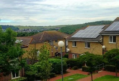 University of Brighton Falmer halls of residence brick building set in countryside with green hills in the background