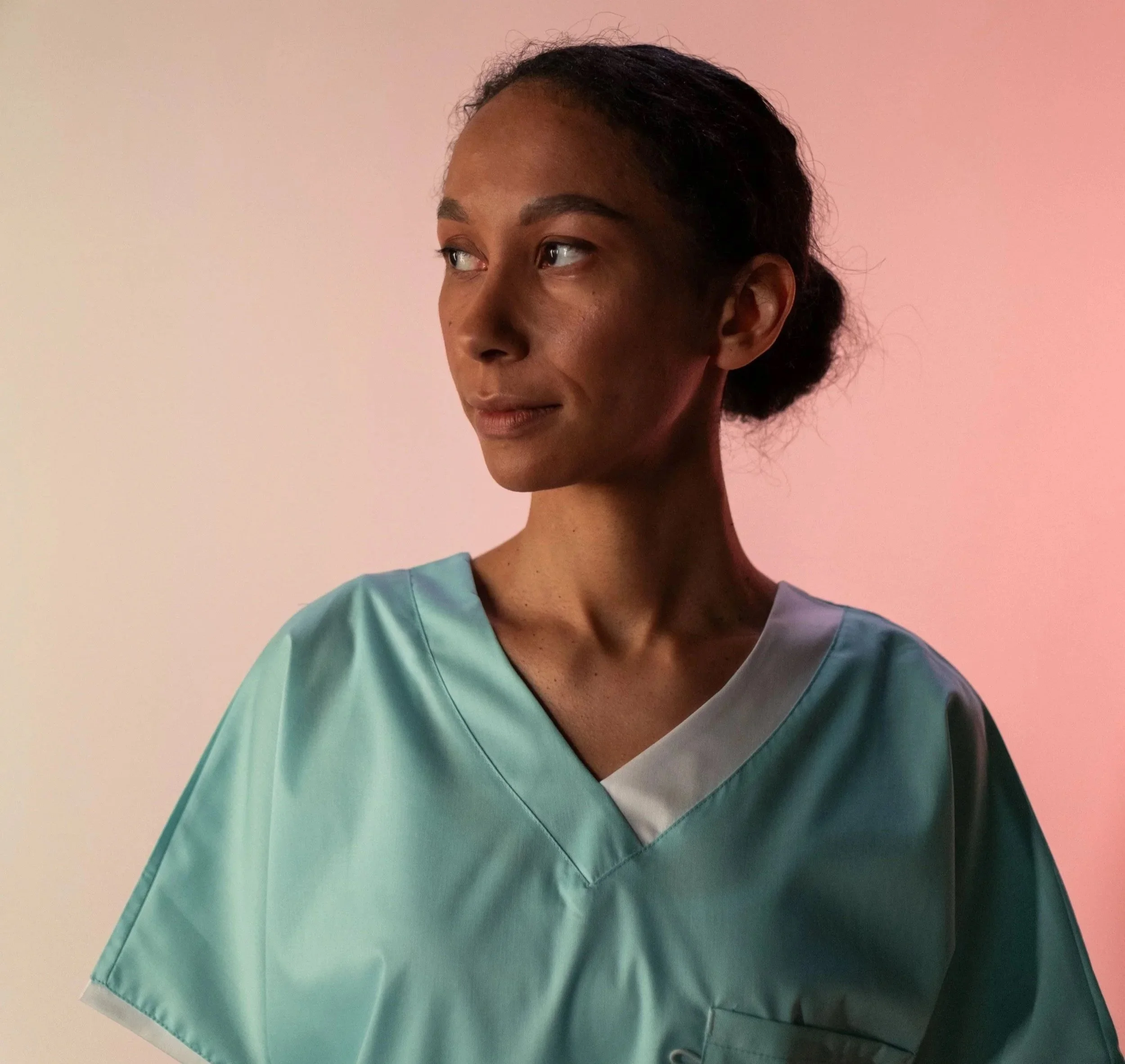 A healthcare professional in scrubs representing the support available to unpaid carers in Brighton and Hove