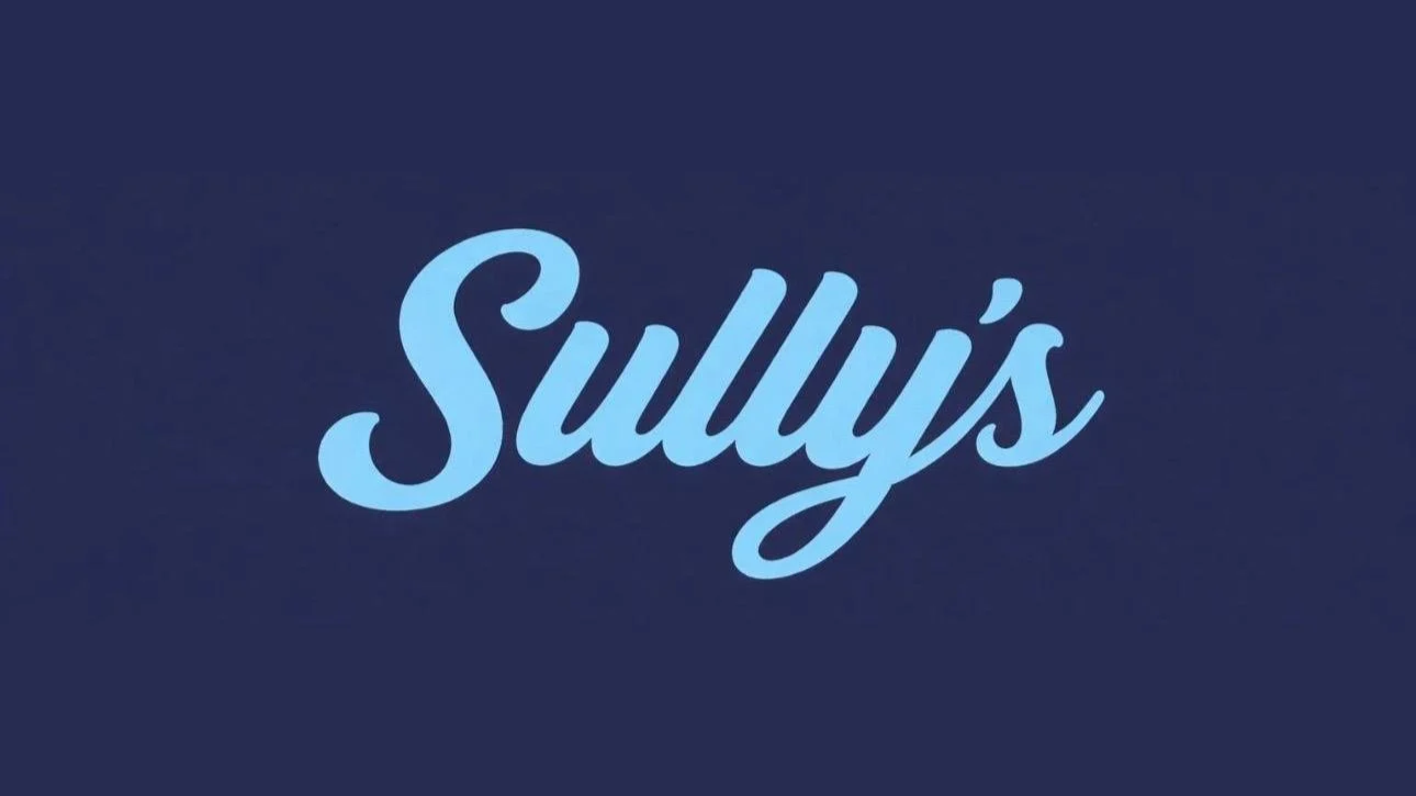 Sully's coffee shop logo in light blue script on a navy background