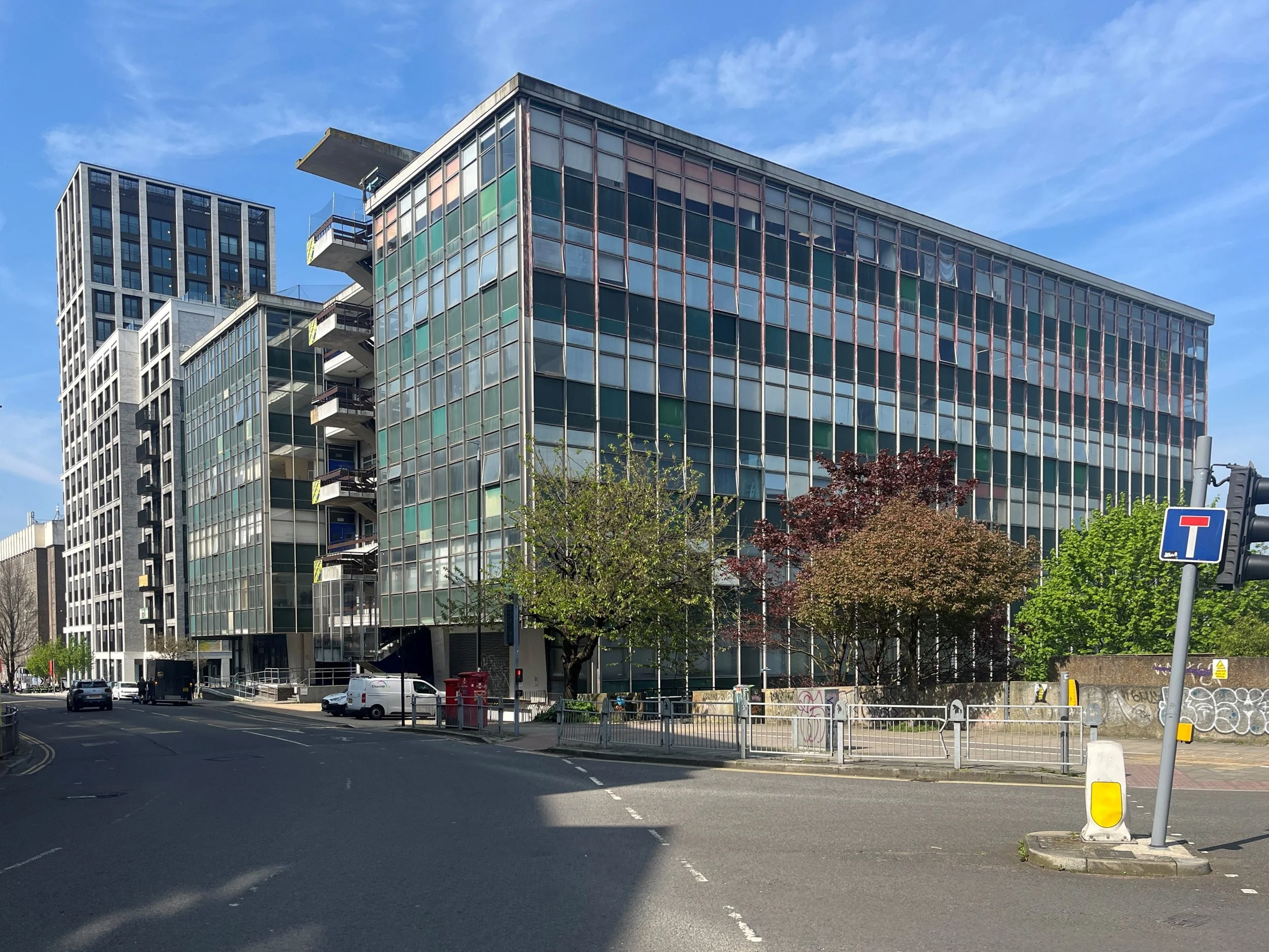The exterior of New England House, a large glazed 1960s office block near Brighton city centre