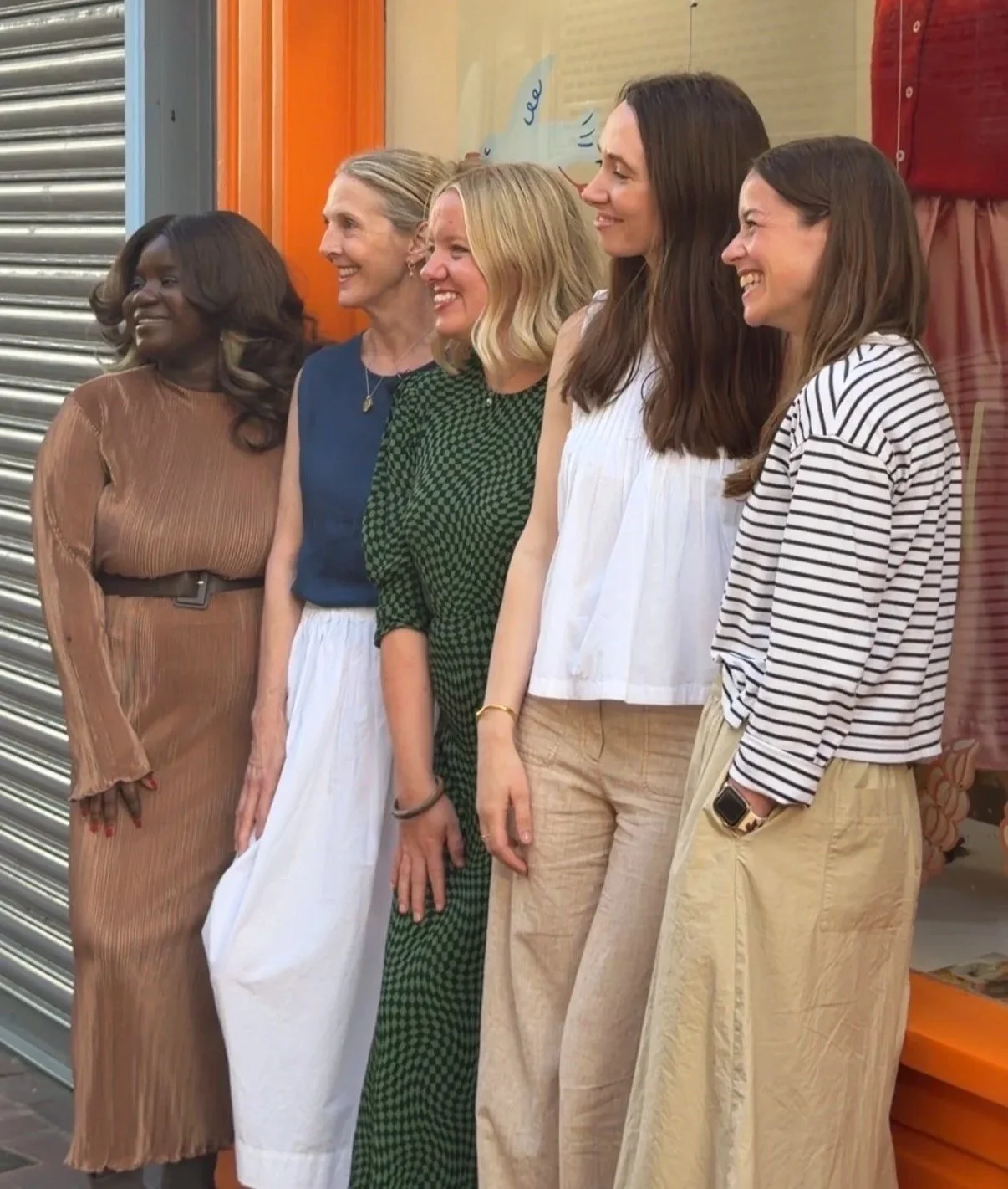 Guests gather at the Brighton pop-up shop launch with grazing tables and drinks under globe pendant lights
