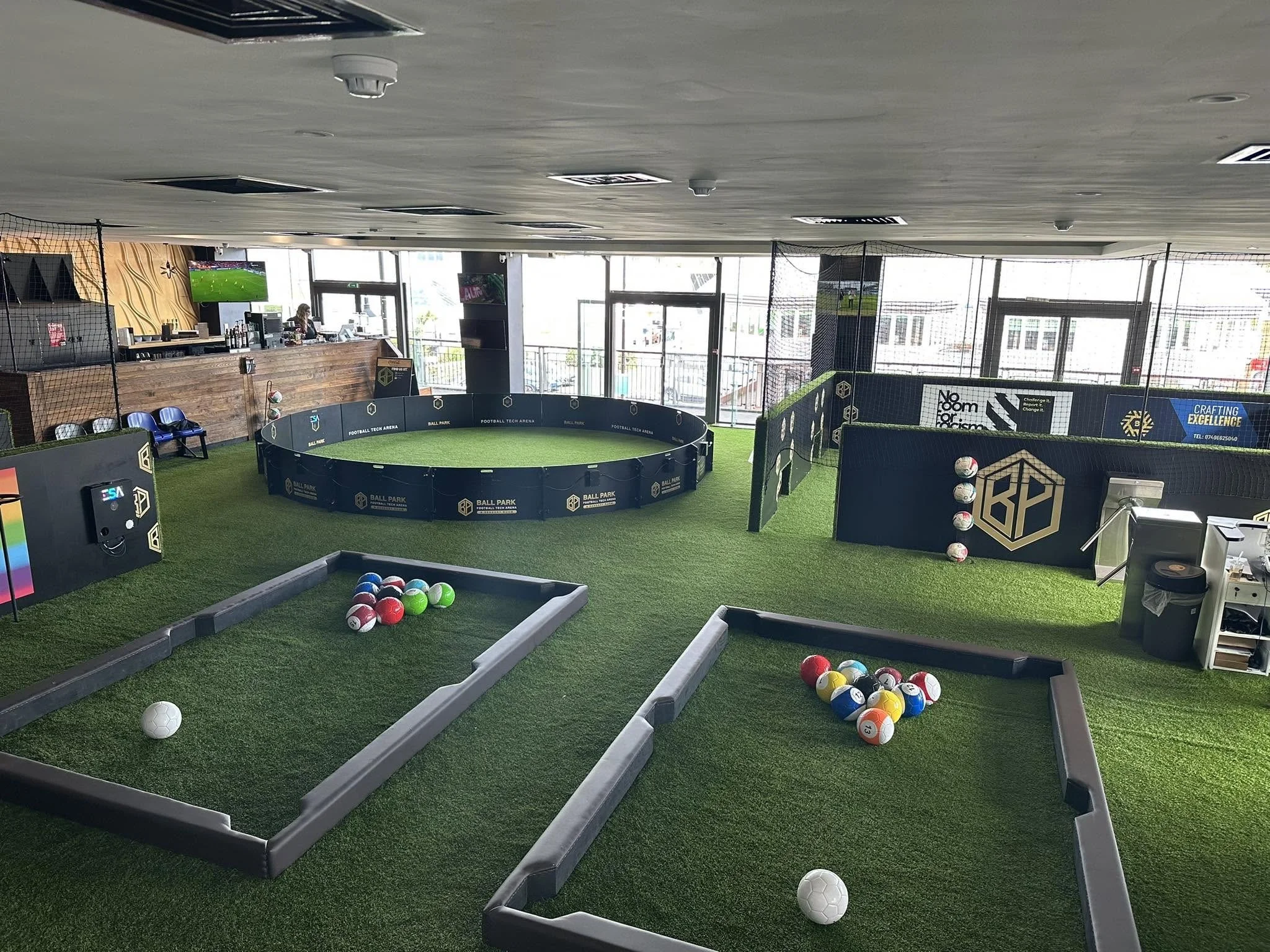 Football tech arena at Ball Park Brighton Marina with a circular pitch, pool tables and bar