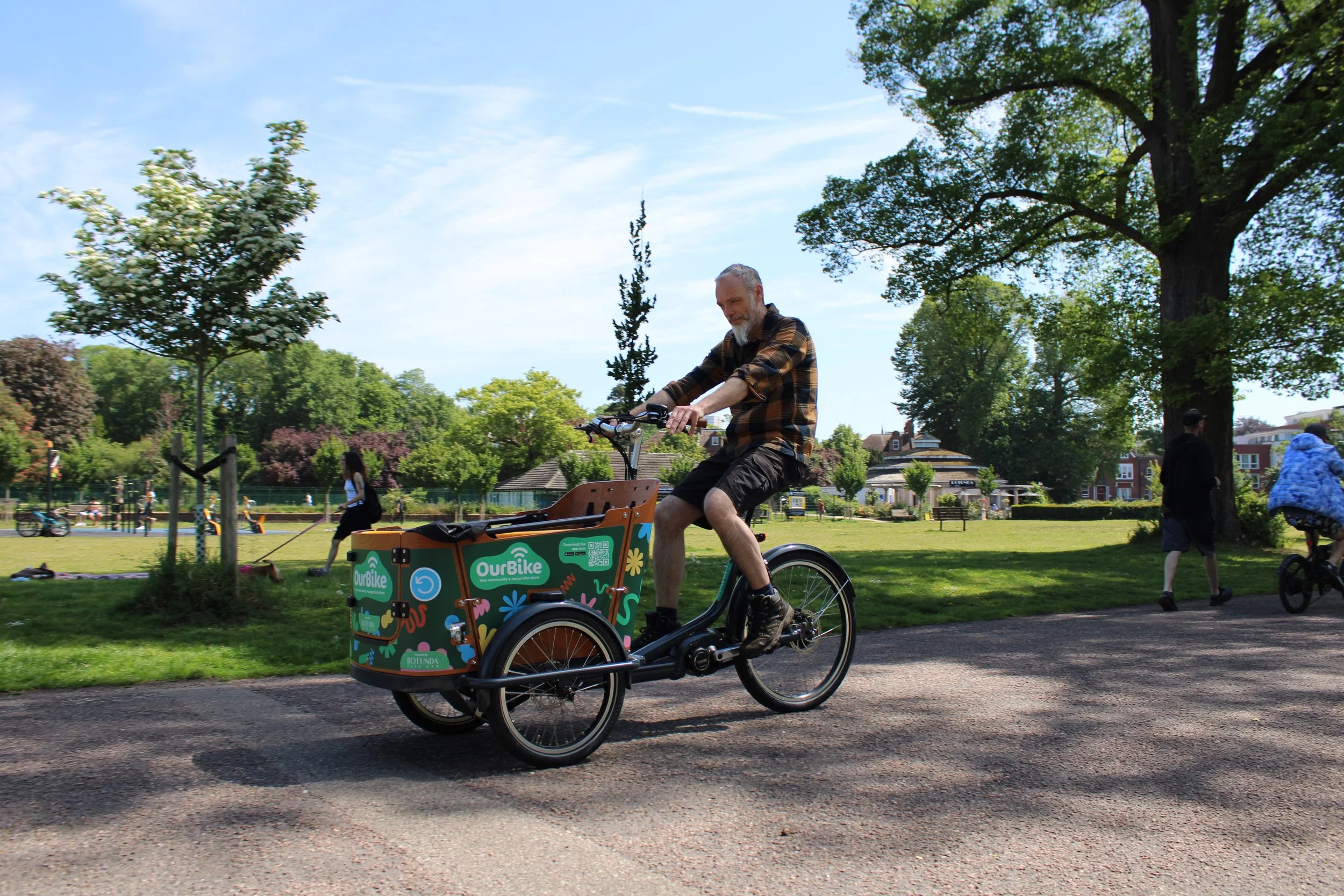 Man riding an OurBike electric cargo bike in Brighton