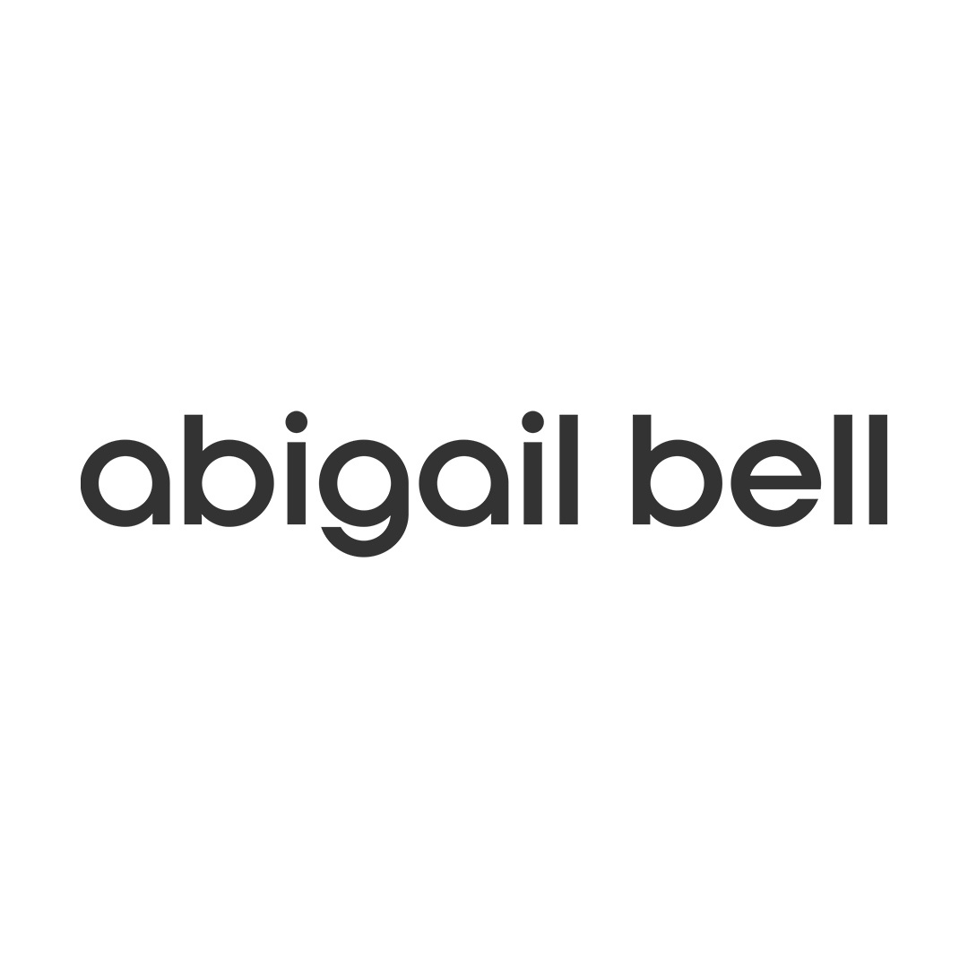 Black and white logo with a top hat, a bow tie, and the name 'Abigail Bell' written below.