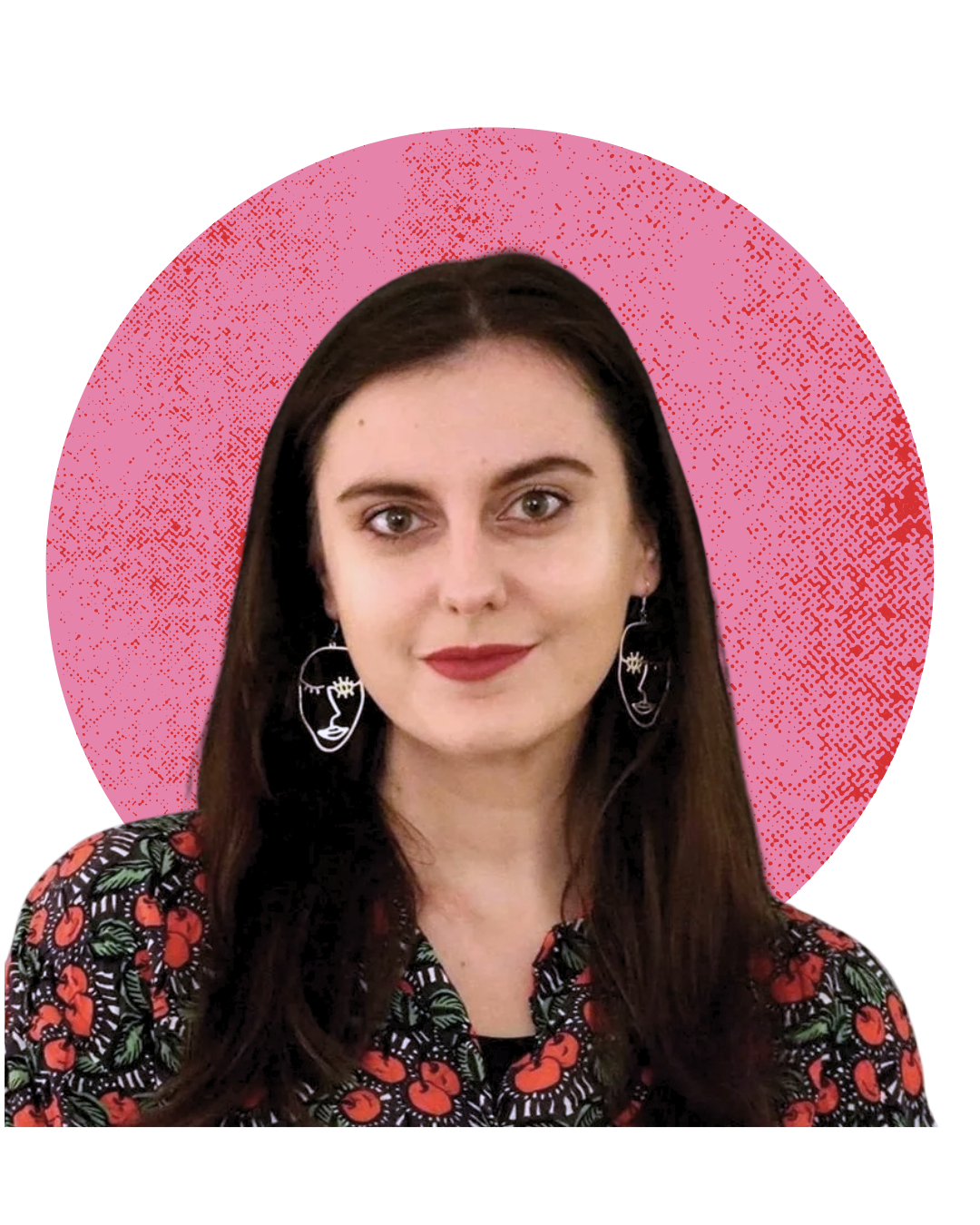 A woman with long brown hair, wearing large artistic face-shaped earrings, a black shirt, and a floral-patterned jacket, standing in front of a pink and black graphic background.