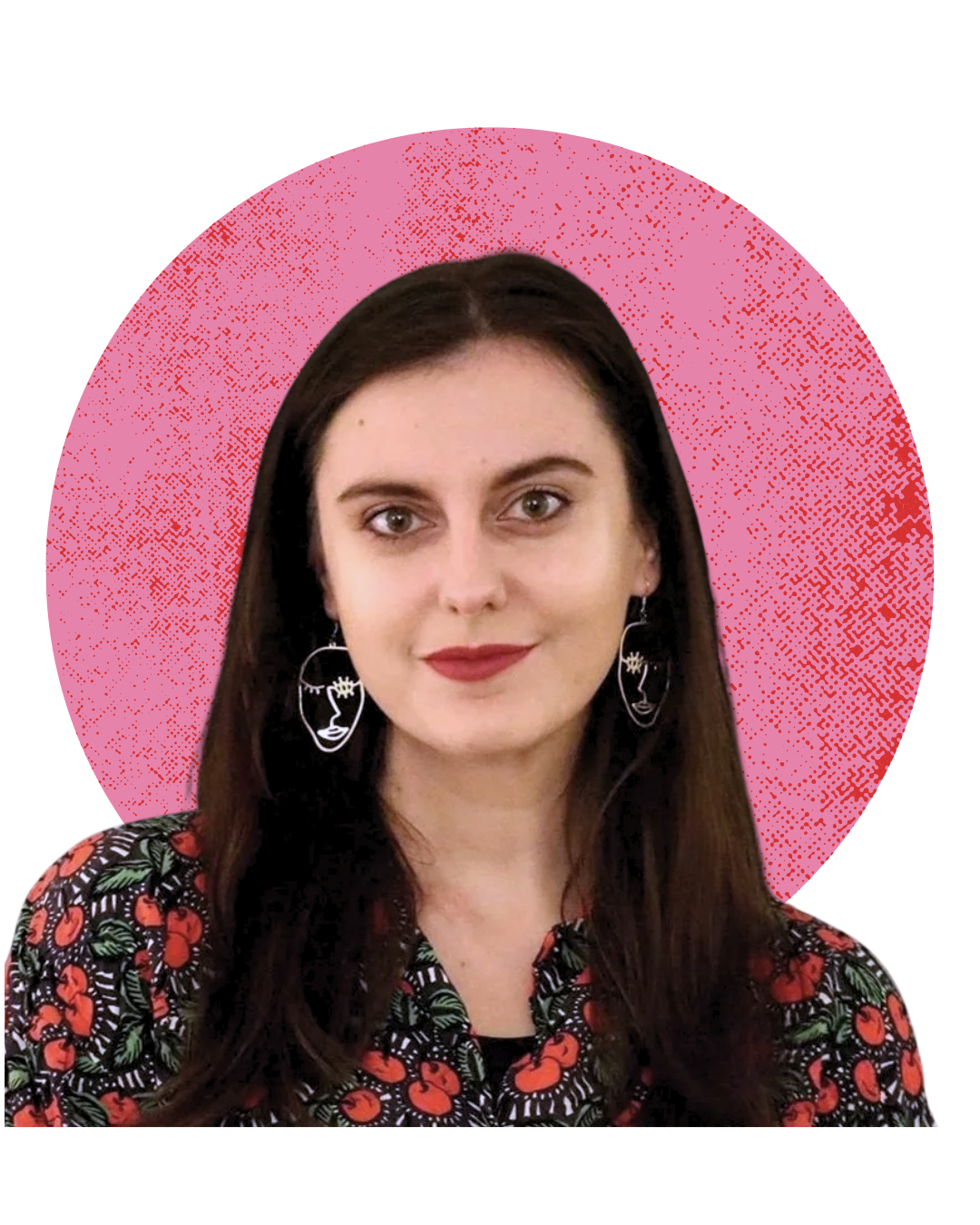 A young woman with long dark hair, wearing artistic face-shaped earrings, a cherry-patterned blouse, standing in front of a pink graphical background.