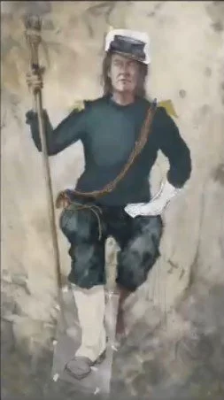 A man dressed as a historical soldier holding a flagpole with a flag, wearing a colonial-style uniform and a hat, standing with one hand on his waist.